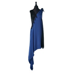 Asymmetrical evening dress in see-through black lace and blue silk jacquard 