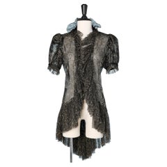 Asymmetrical evening jacket in black and gold lace 1930