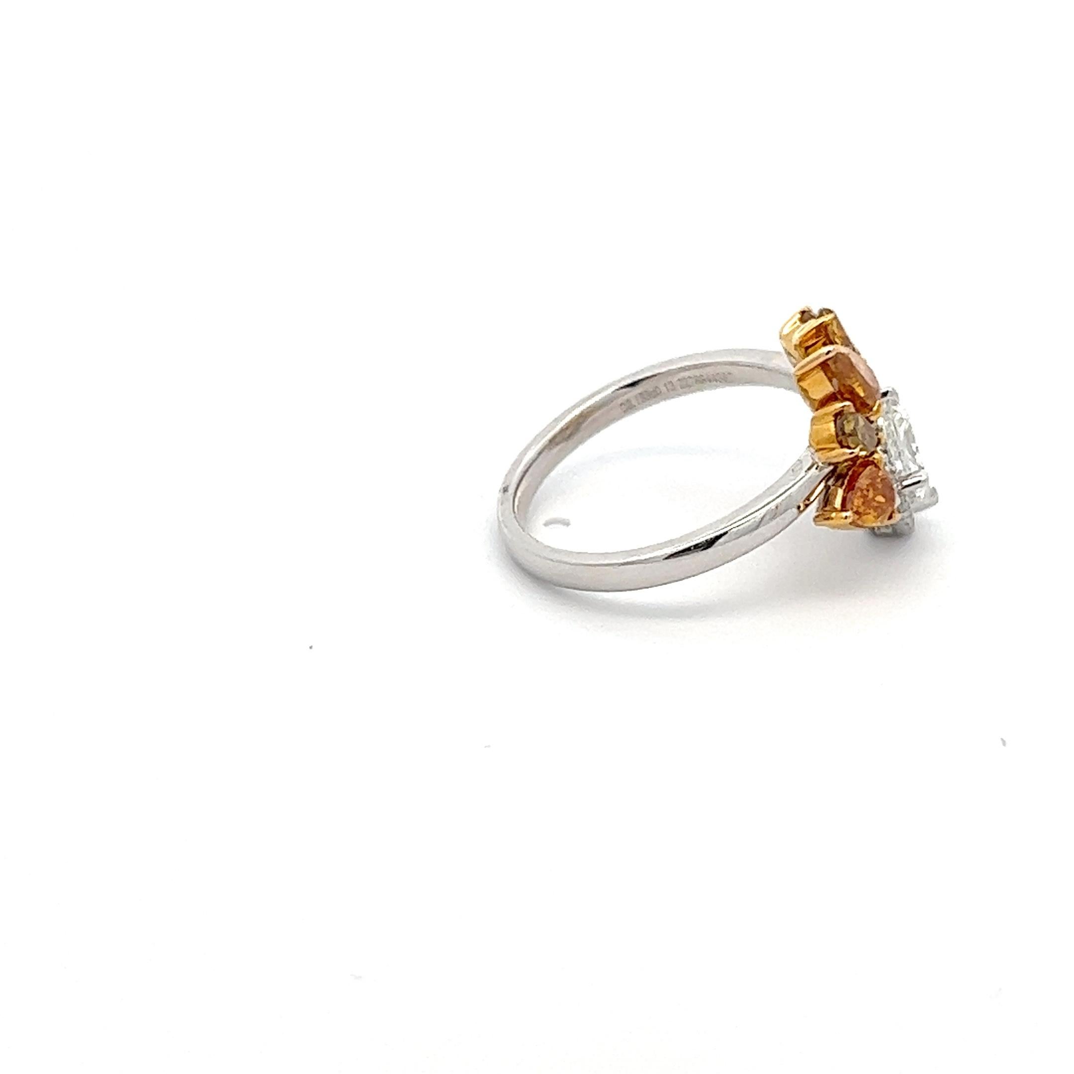 Introducing our stunning asymmetrical ring, a true embodiment of elegance and sophistication. Crafted from the finest 18K two-tone gold, this exquisite piece features a Radiant cut G/VS2 diamond weighing 1.02 carats at its center, surrounded by a