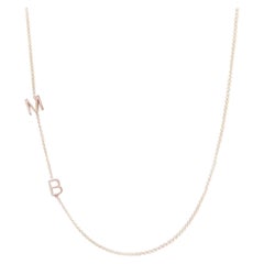 Collana asimmetrica con iniziali M B in oro giallo 14K