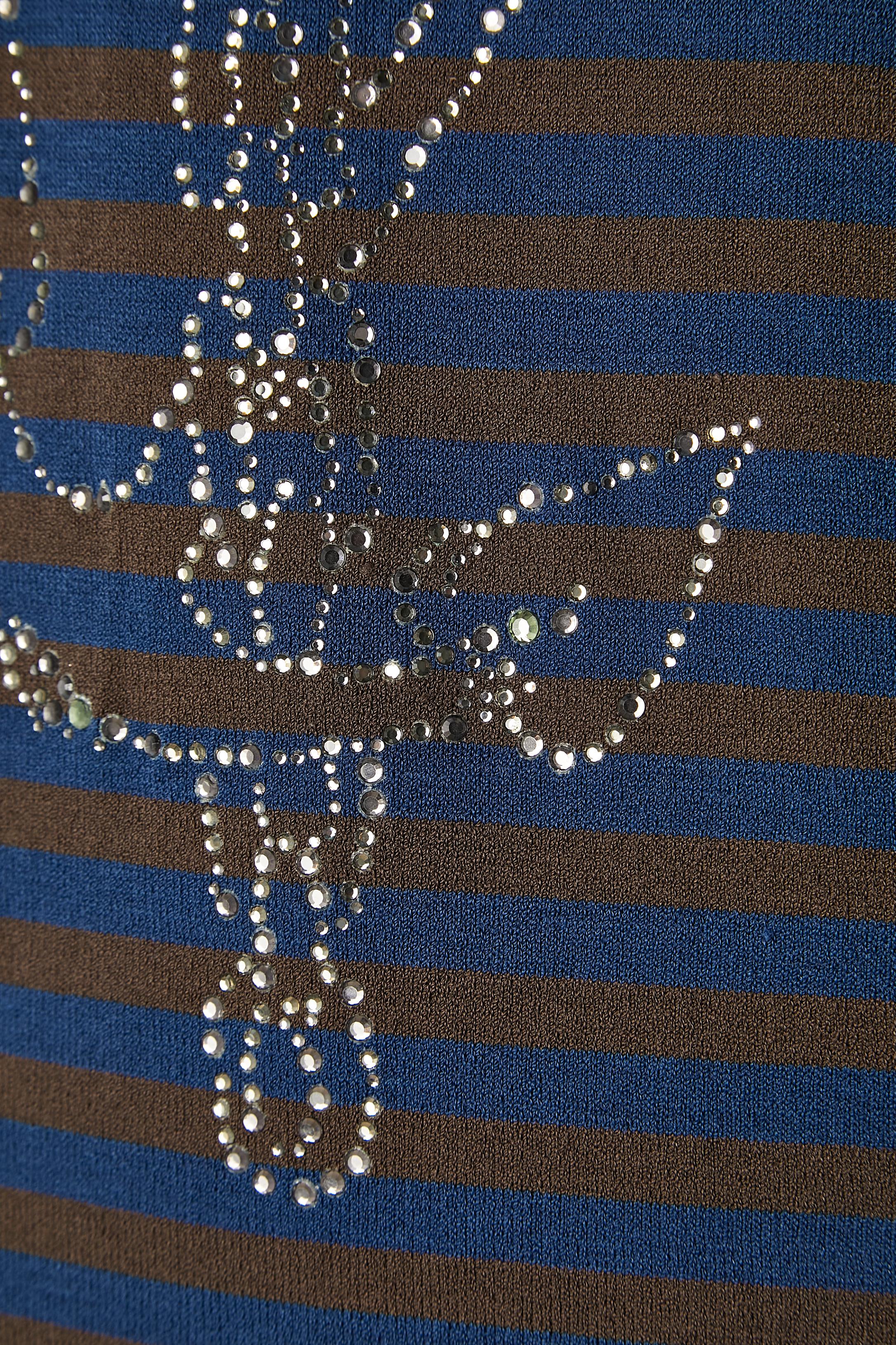 Asymmetrical jersey tank-top with stripe and rhinestone. Fabric composition: 65% rayon, 35% polyamide. 
SIZE XL on tag but fit M 