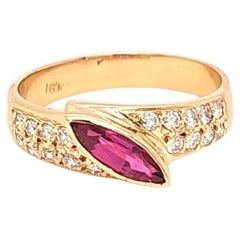 Asymmetrical marquise ruby and diamond ring
