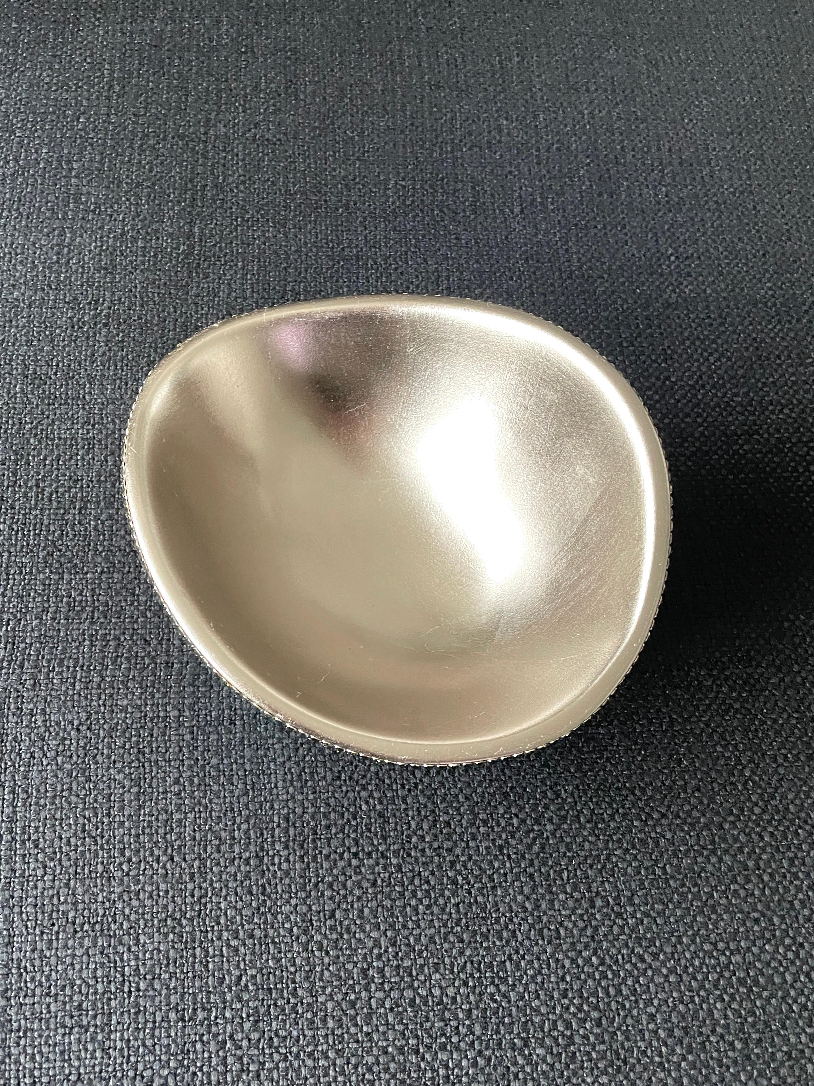 Asymmetrical Metal Bowl Paved Crystals:
The two in this photo are only for color.This is sold as a single piece (Silver). 
My aim as an Artist is to do things that have never been seen because they were never done. From my research I have never seen