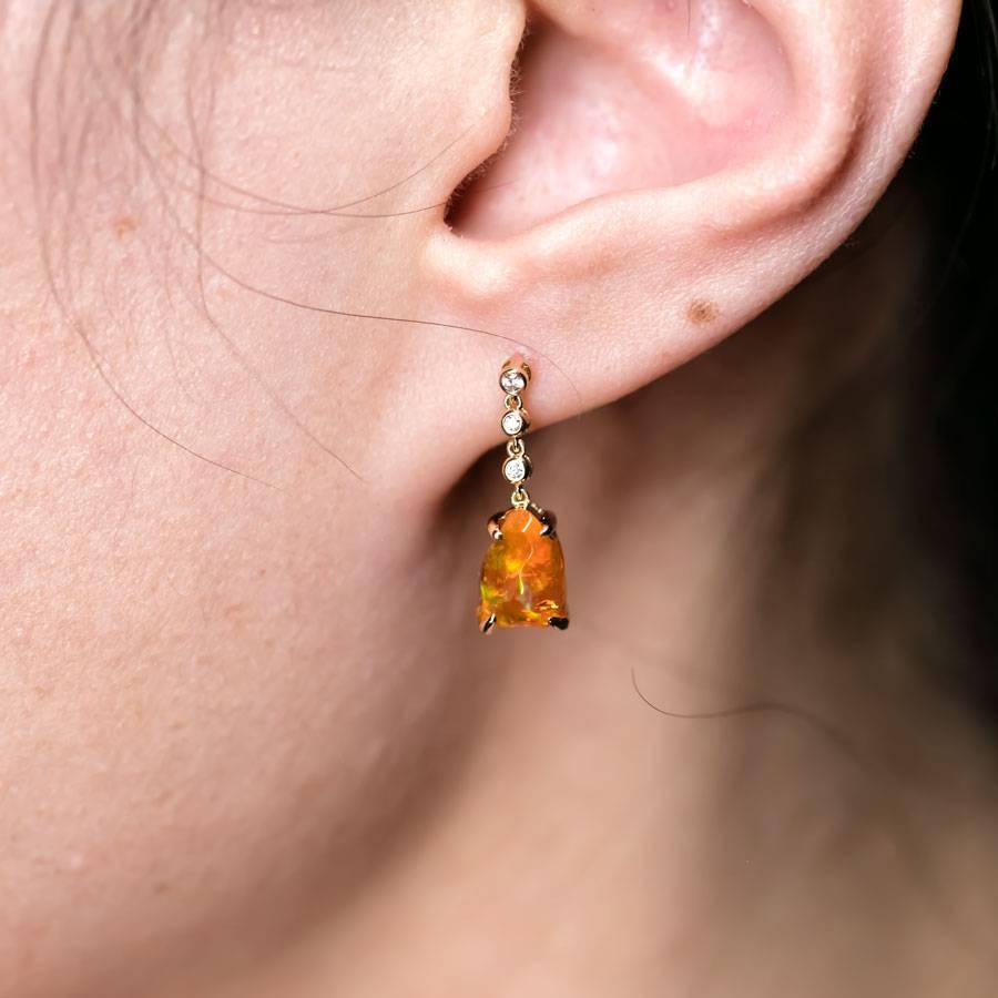 Asymmetrical Mexican Fire Opal Diamond Drop Earrings 18K Yellow Gold.


Free Domestic USPS First Class Shipping!  Free One Year Limited Warranty!  Free Gift Bag or Box with every order!



Opal—the queen of gemstones, is one of the most beautiful
