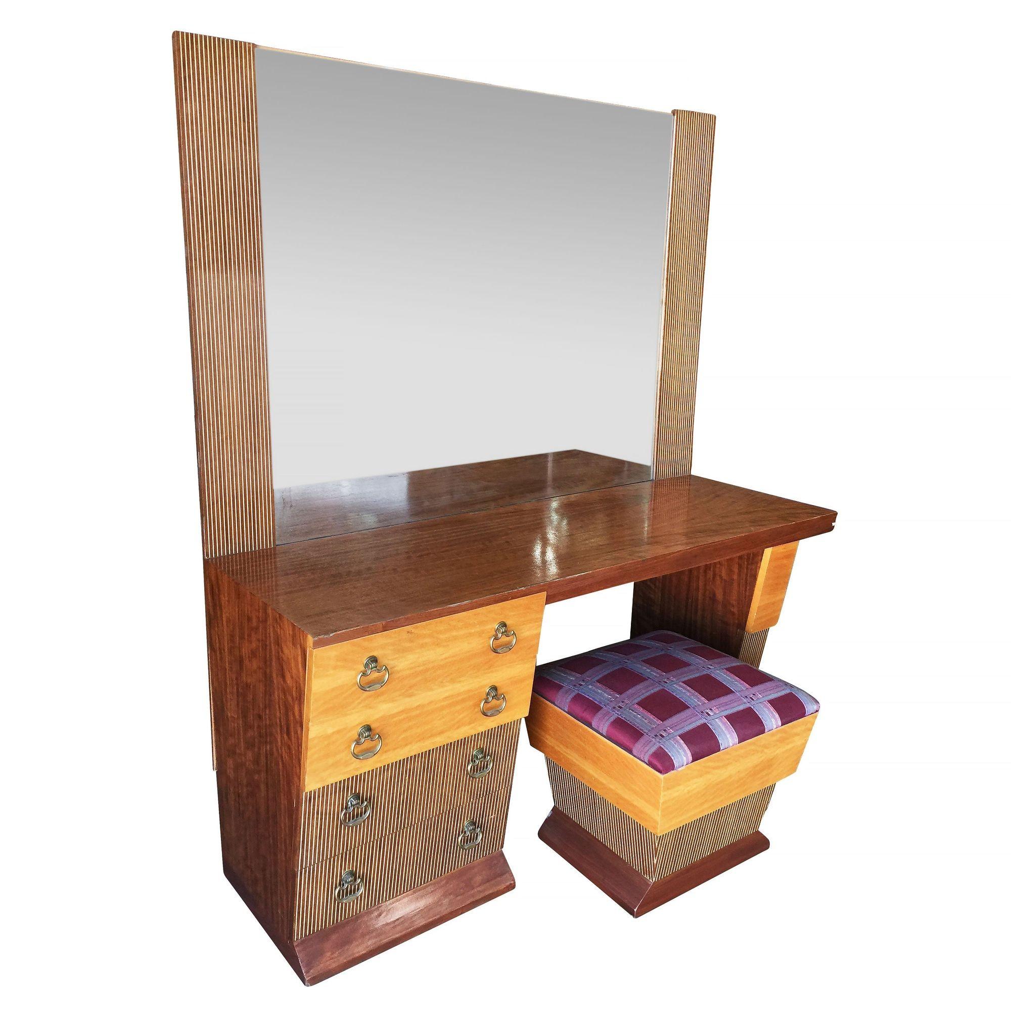 Custom-made bespoke asymmetrical Mid-century bedroom set complete with vanity, stool, and nightstand. The set features a unique Googie design with a mix of hardwood patterns with painted wood inlays and brass drawer pulls. Both the vanity and the