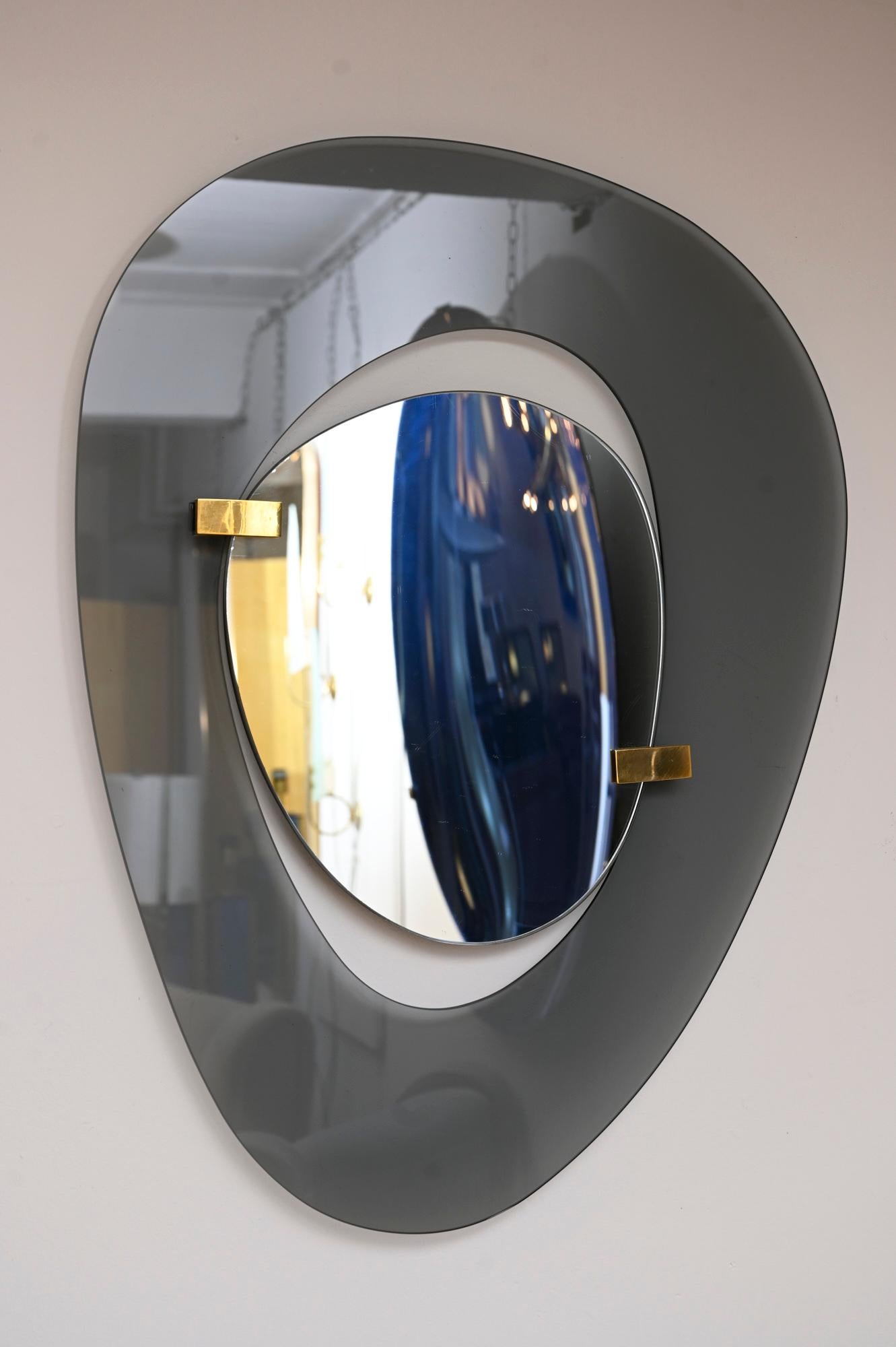 Rare asymmetric mirror by Max Ingrand for Fontana Arte. 

Glass is beautiful grey colour 

Fontana label verso.