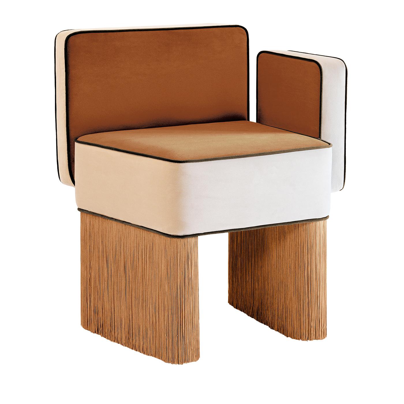 Asymmetrical Velvet Armchair in vibrant orange velvet with black piping and orange fringed legs, this bold and sophisticated armchair features an asymmetrical, sculptural design. The generously padded seat offers plush velvet comfort, while the
