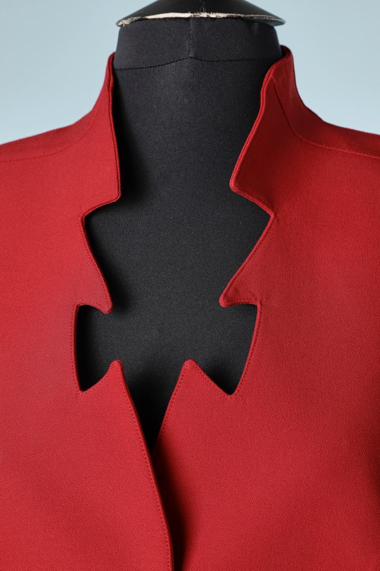 Asymmetrical Ruby red sigle breasted jacket with cut-work collar. Snap in the middle front. Fabric composition: 18% wool, 29% acetate, 53% rayon. SIZE 36 (S)