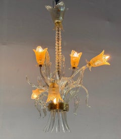 Asymmetrical Venetian chandelier in colorless and gold Murano glass, around 1980