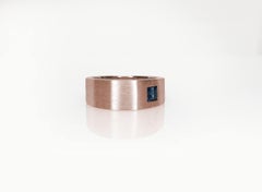 Asymmetrically Set Solitaire Sapphire Rose Gold Ring
