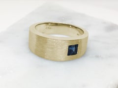 Asymmetrically Set Solitaire Sapphire Yellow Gold Ring