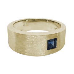 Asymmetrically Set Solitaire Sapphire Yellow Gold Ring