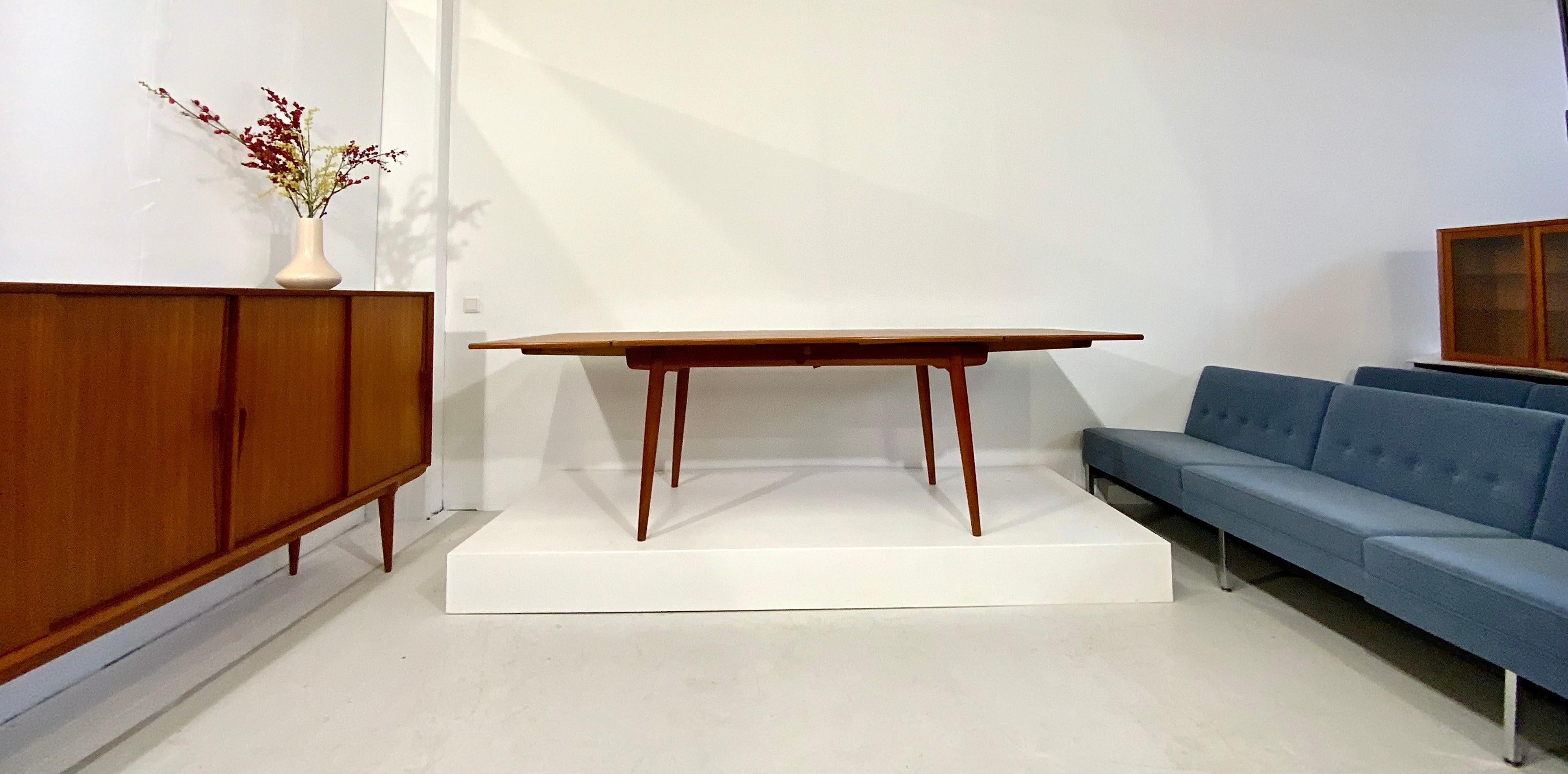 This Danish modern vintage furniture and teak dining table classic was designed in 1950s by the well-known designer for Danish furniture's Hans Wegner for the cabinetmaker Andreas Tuck in Denmark.
This dining table is from highest quality, a