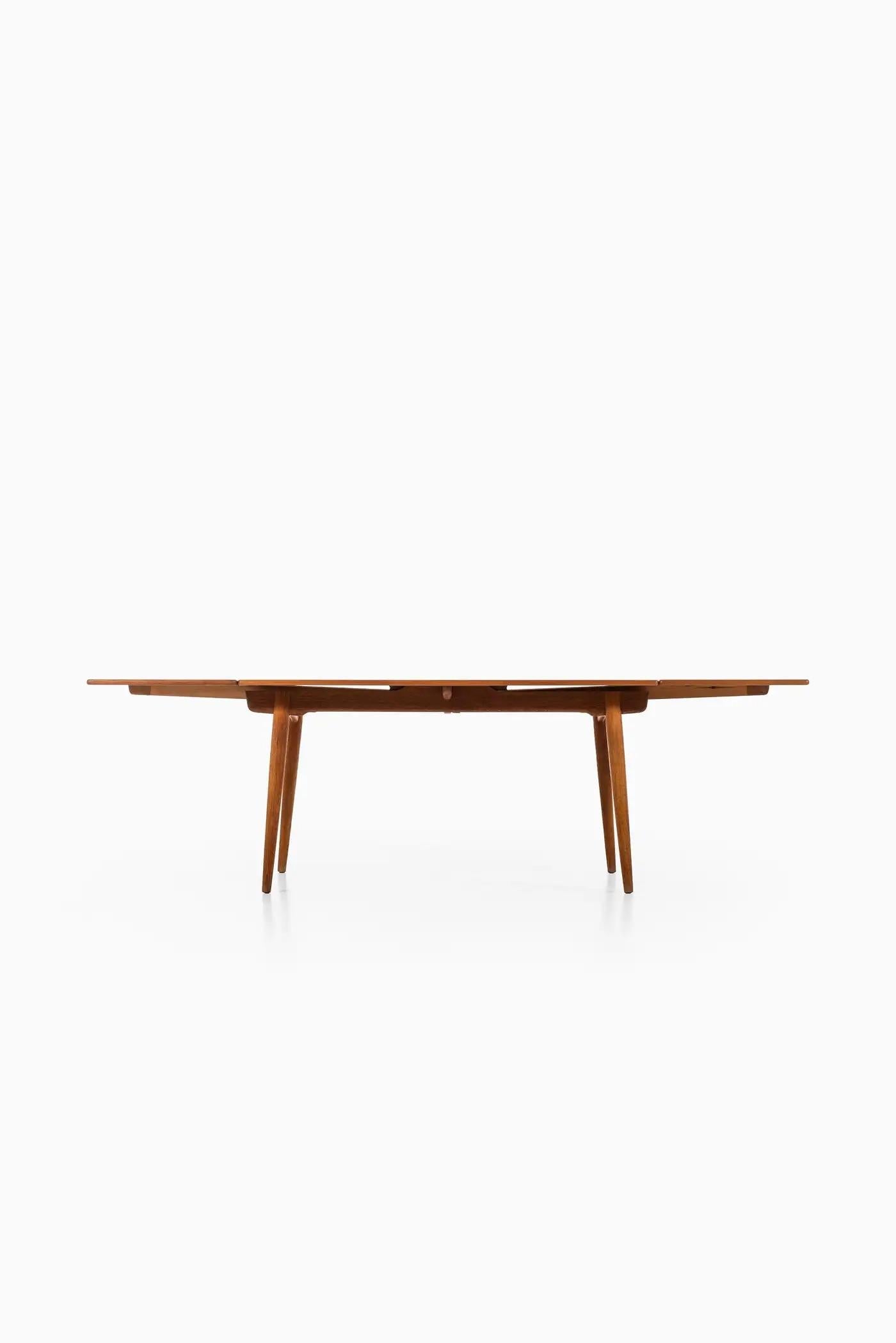 Created by Hans Wegner, recognized as one of the leading designers of the Danish mid-century modern movement, this table is the epitome of functional modernity. The 