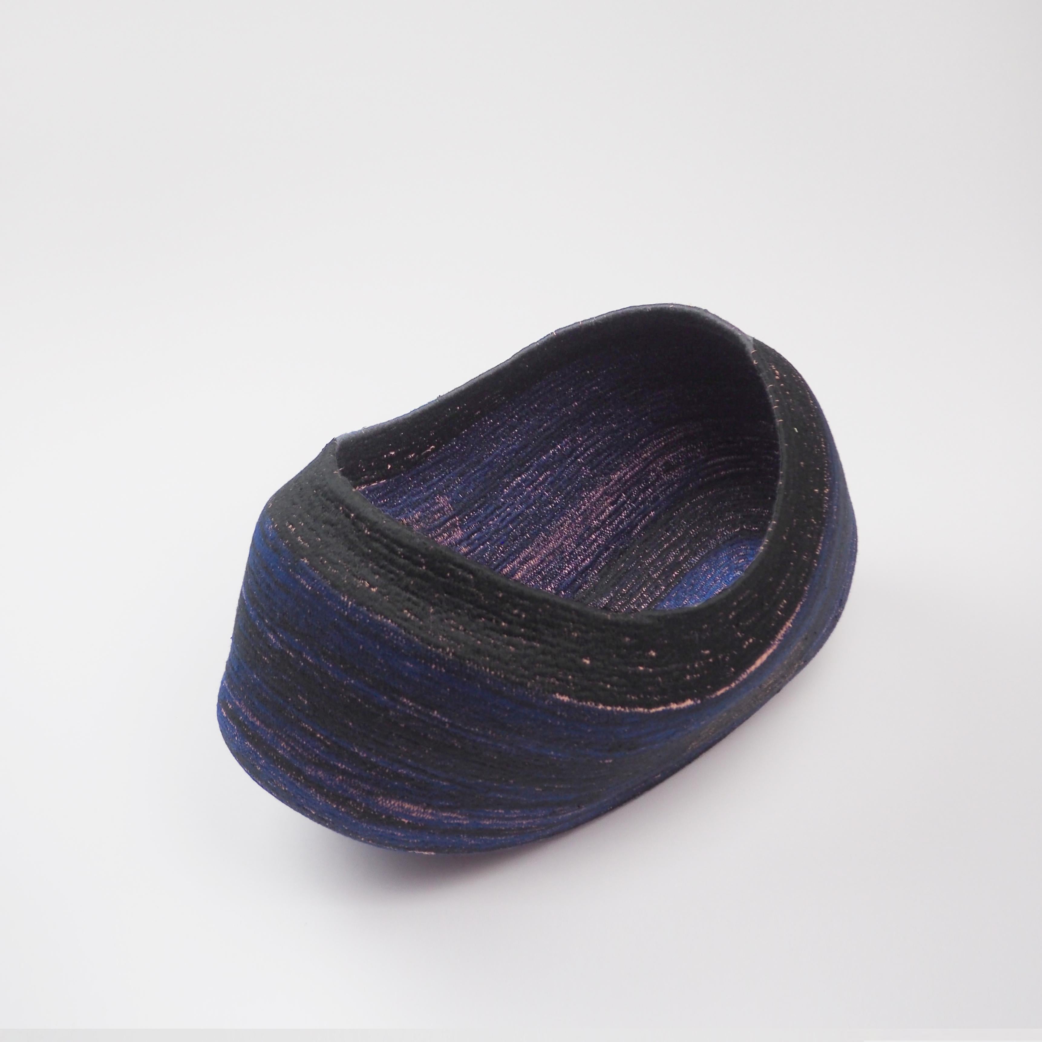 AT- CN Vessel by Cristina Vallejo
Dimensions: W 34 x D 24 x H 22 cm
Materials: 100 % Cotton cord and polyester thread.
Weight: 0.38 Kg

ELSUR is a furniture and product publisher, established in Madrid since 2014. Interested in the relationship