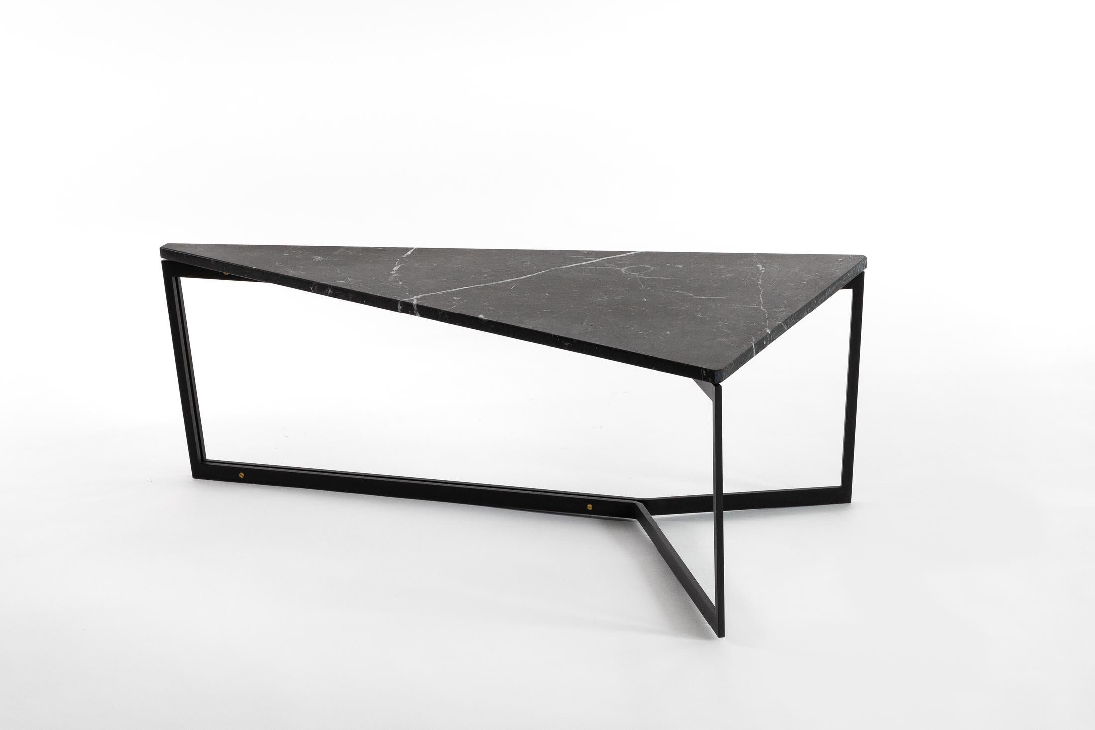 AT14 is a triangular handmade coffee table with a sleek crafted metal base and polished marble or hardwood tabletop

Shown in black marble and blackened cold-rolled steel with bronze accents, and white marble with bronze base. 

Dimensions: 24” L x