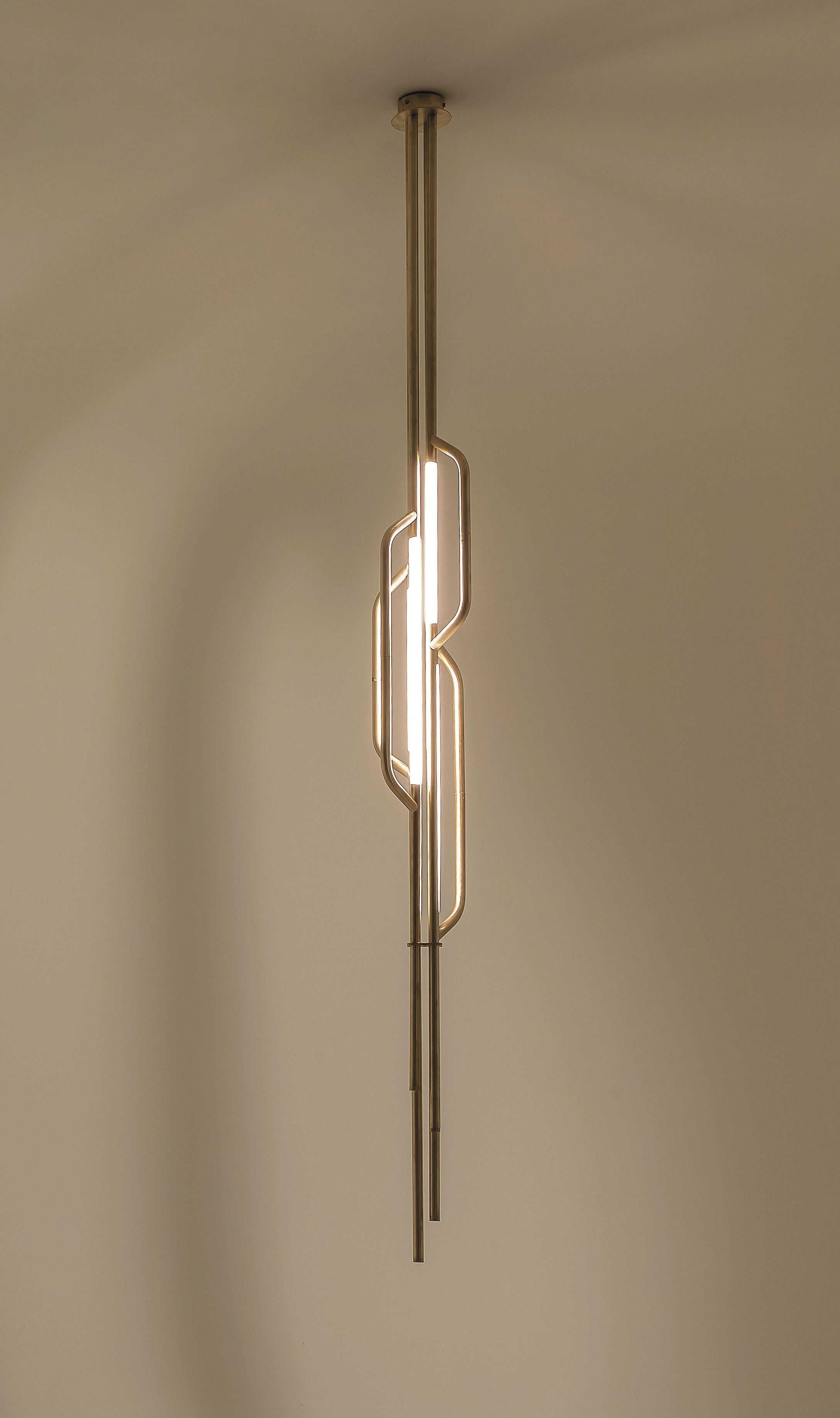 AT624 Suspension Lamp in Satin Brass with 4 White Acrylic Diffusers by Daluce
Dimensions: Ø 23 x H 228,3 cm. 
Materials: Brass and acrylic.

Available in different finish options: light satin burnished brass, medium satin burnished brass, and dark