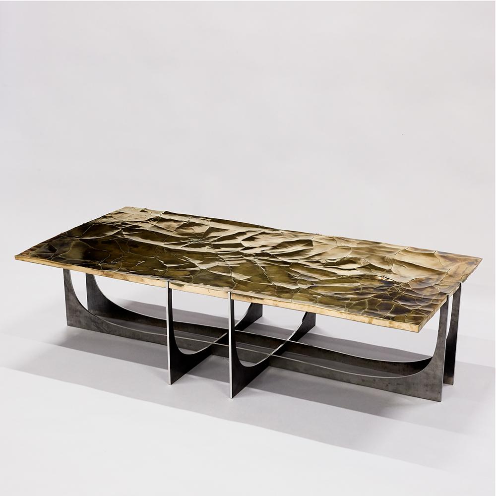 Atacama coffee table, made with bronze and steel, is designed by Erwan Boulloud, a French artist represented by Galerie Negropontes in Paris, France. 

Erwan Boulloud is a graduate of the Ecole Boulle. He began by collaborating with a number of