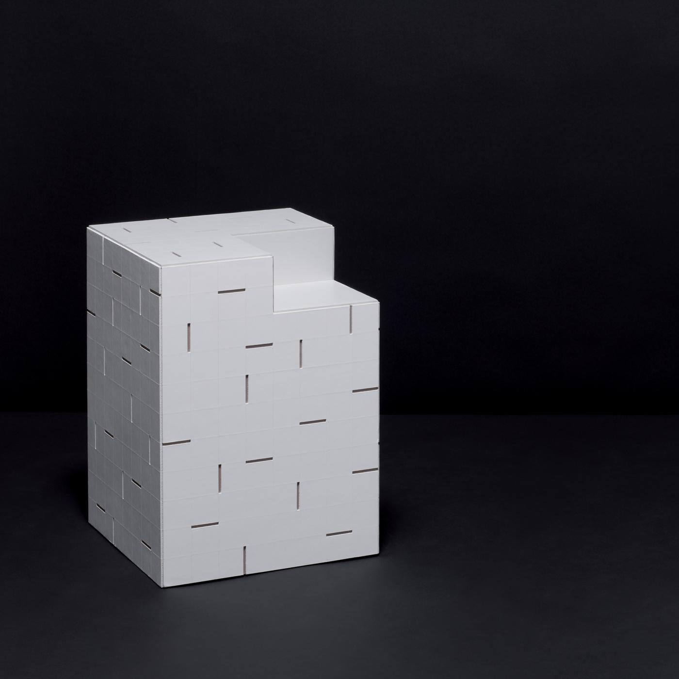 The minimal modern frame of this unique and luxurious nightstand designed by StÃ©phane Parmentier is entirely made of the finest saddle leather in arctic white with tonal stitching and interspersed black grooves. The elegant cubic silhouette has a