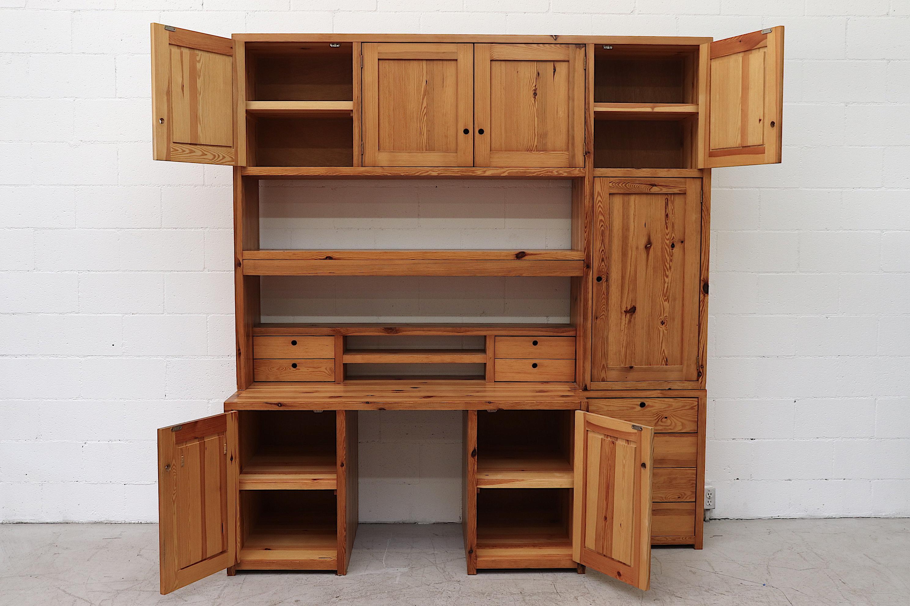 Custom designed extra large Ate Van Apeldoorn pine wall unit. Three individual pieces consisting of a lower desk with double storage cabinets, a small storage cabinet with four drawers, both topped with a large upper unit with plenty of overhead