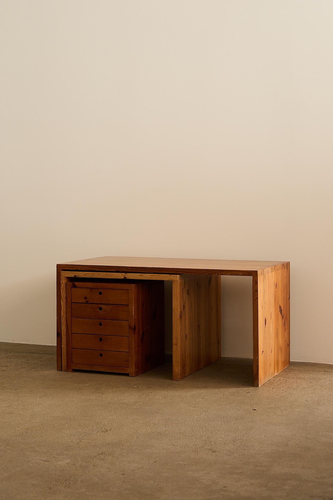 Set of three minimalist pine pieces by Ate Van Apeldoorn for Houtwerk Hattem, Netherlands. Designed in the 1960s, this modular set includes a large desk, a smaller desk, and a drawer unit, all crafted from solid pine with exposed wood joints,