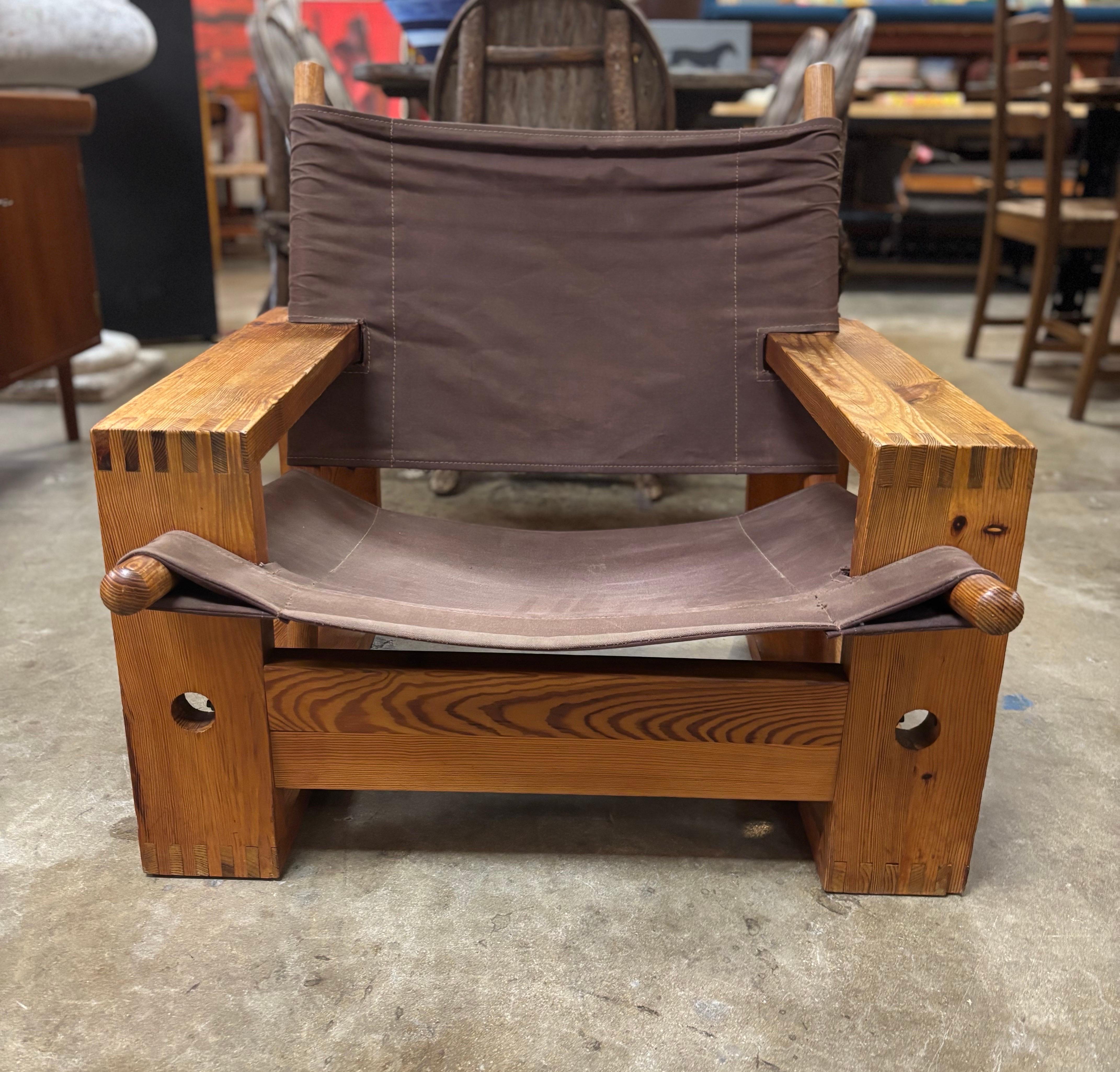 Mid-century modern Ate van Apeldoorn easy chair made of solid pine and canvas, Netherlands, circa 1960s. This lounge chair sits low and is in good condition. Canvas could use cleaning and chair has age-appropriate wear to pine as seen in photos.