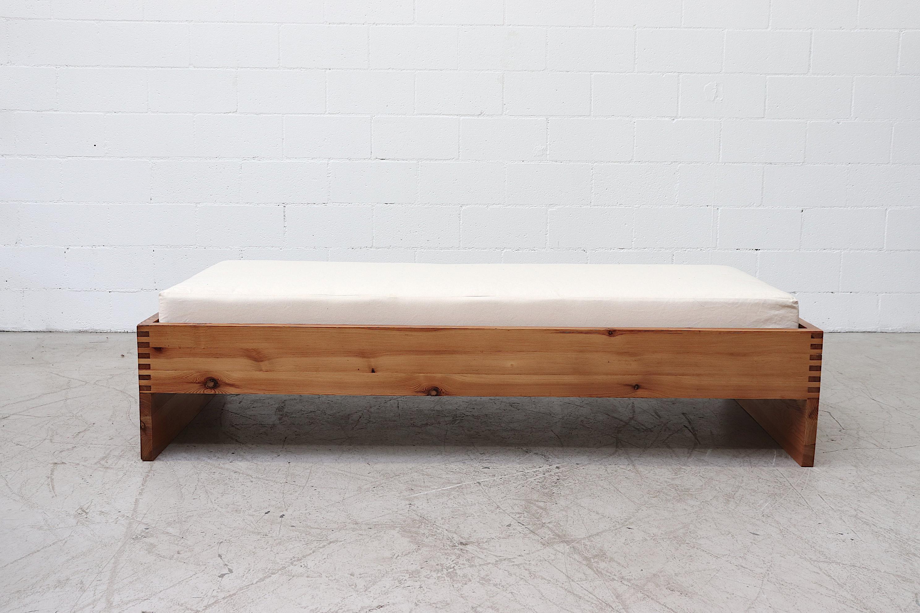 Lightly refinished natural pine platform daybed or bed by Ate Van Apeldoorn. Good original condition with light wear. The custom mattress measures 74 x 32 x 8, leaving room for bedding.