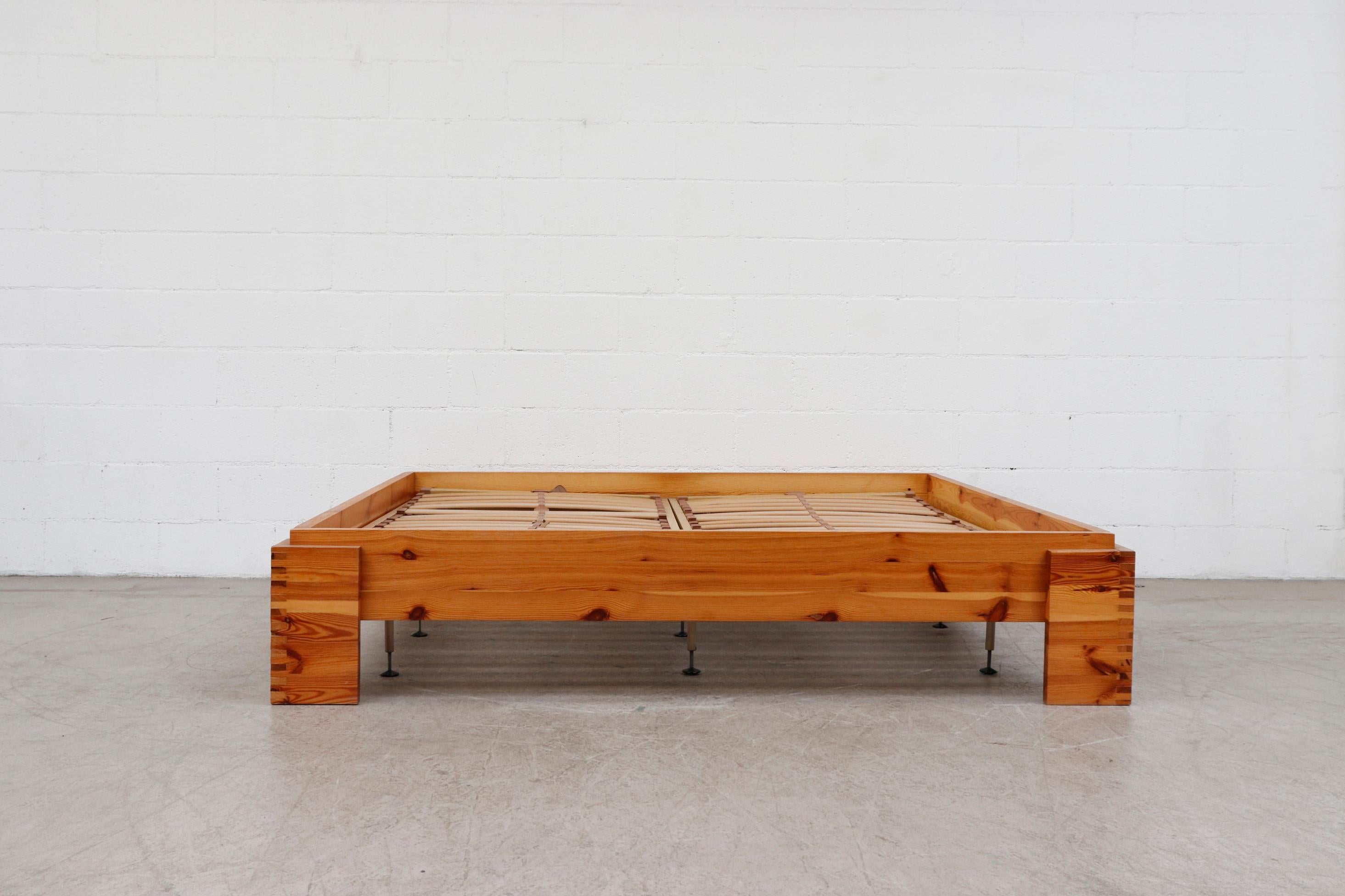 Midcentury Ate Van Apeldoorn pine European king bed frame. Shown with original adjustable plastic slat inserts. These are poor condition and just used for show as they came from the original owners. Metal supports are included if desired. Inside