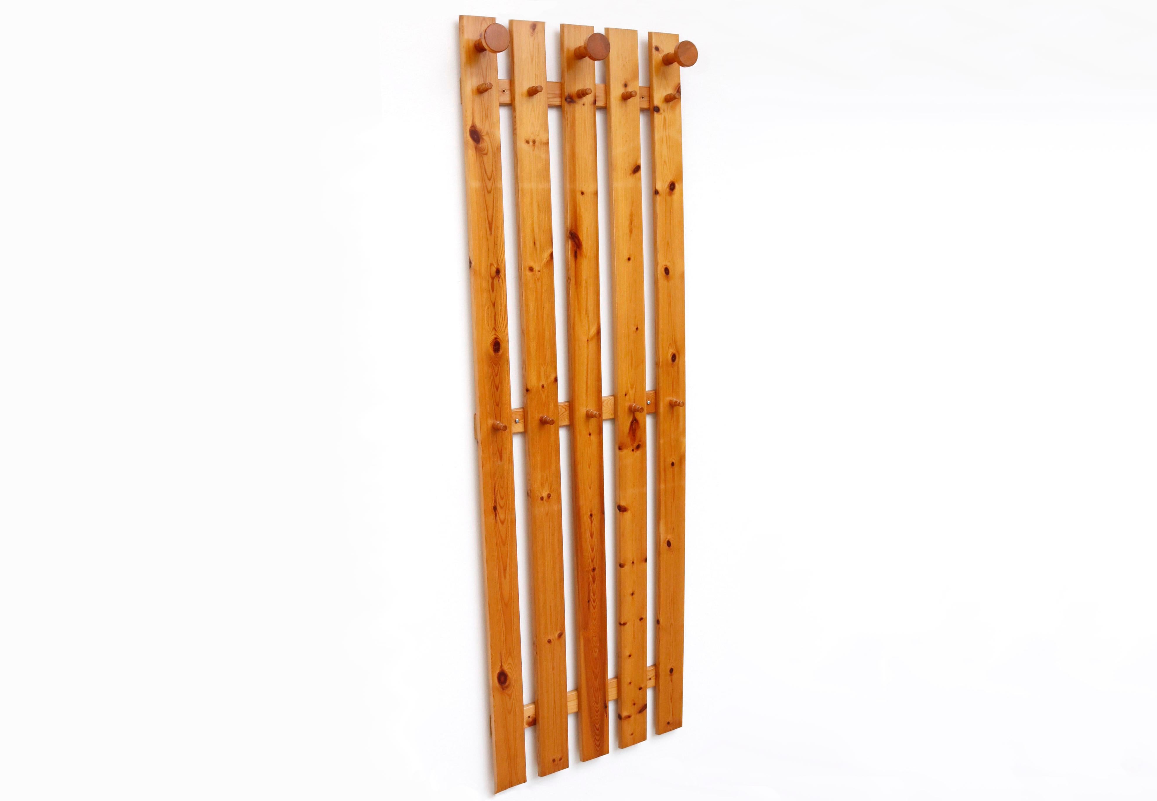 Ate van Apeldoorn pine slatt wall mount coat rack with carved button knob hooks. In impressive overall condition with light refinishing.