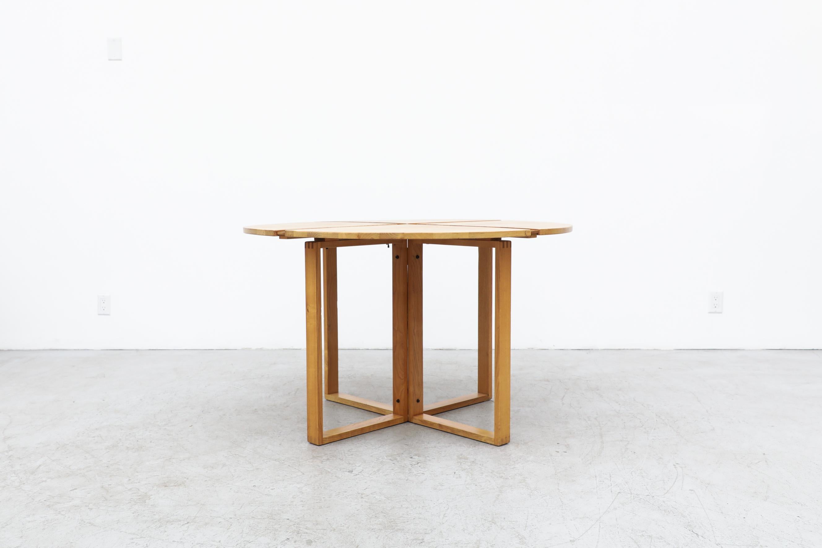 Ate Van Apeldoorn attributed round oak dining or center table with more intricate composition on the top than is customary for Ate. The base has box joint frame, In original condition with some wear consistent with its age and use. There's a
