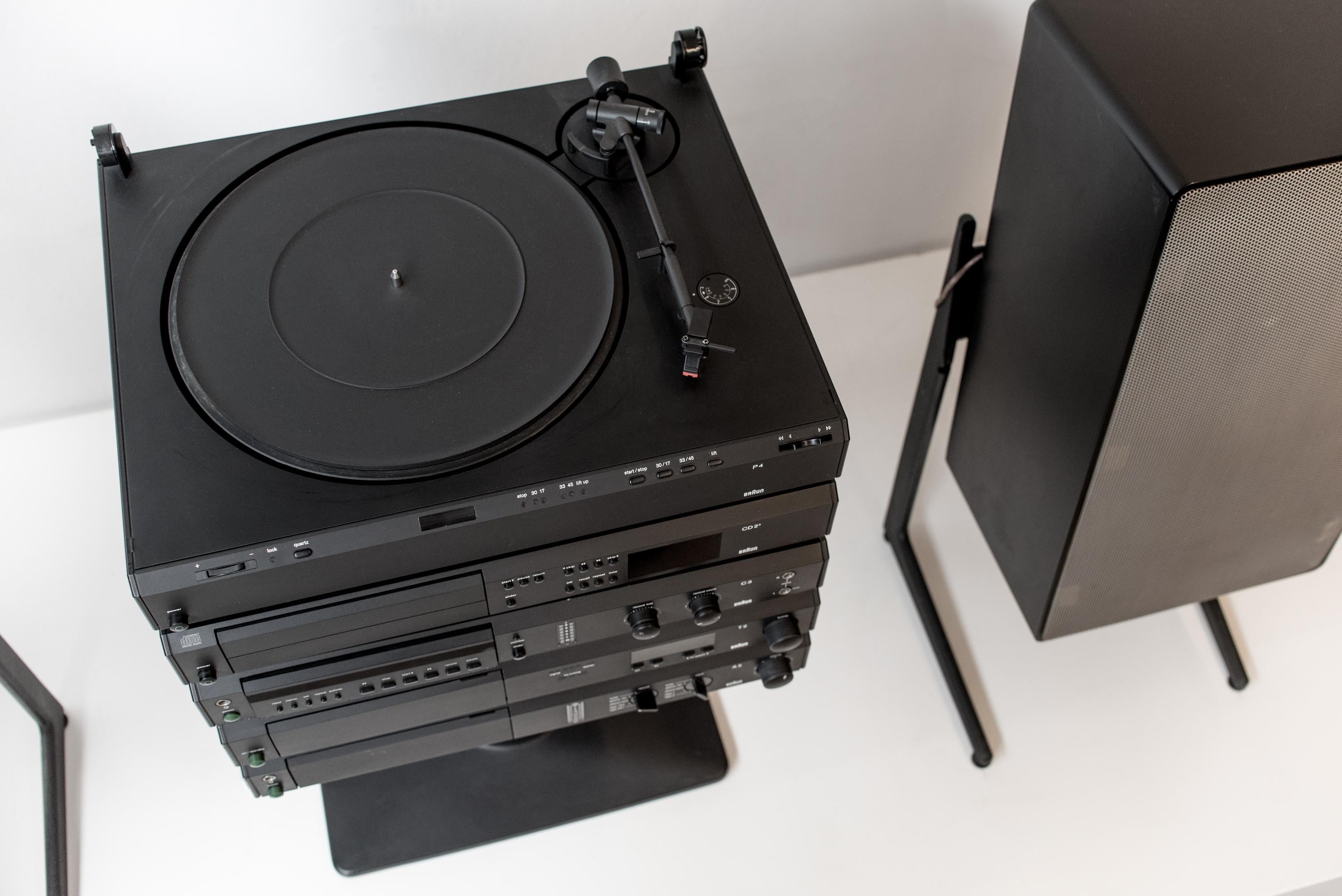 Complete Atelier 3 Braun HiFi stereo-system designed by Dieter Rams. Turntable P1 with cart, Amplifier A1, CD2/3 and with original Stand AF1. Decks in black lacquered steel cover. Stand AF1 in black lacquered plastic with three internal sockets and