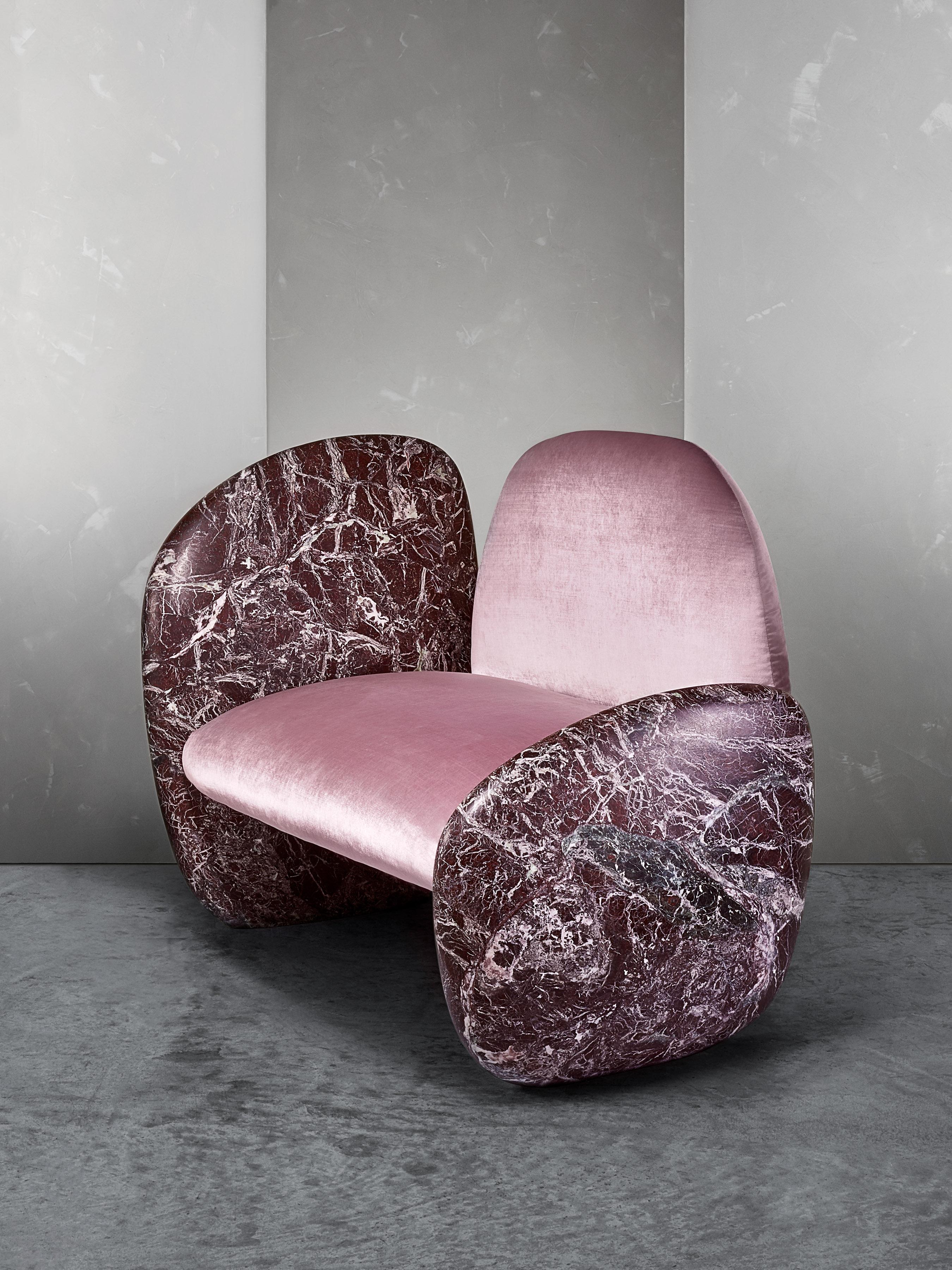 The Cabochon Lounge Chair is a rich combination of asymmetrical Calcutta marble and Paonazzo fabric. World renowned Italian designer, Antonio Pio Saracino, drew inspiration for The Cabochon Lounge chair from our rhodochrosite specimens, detailing