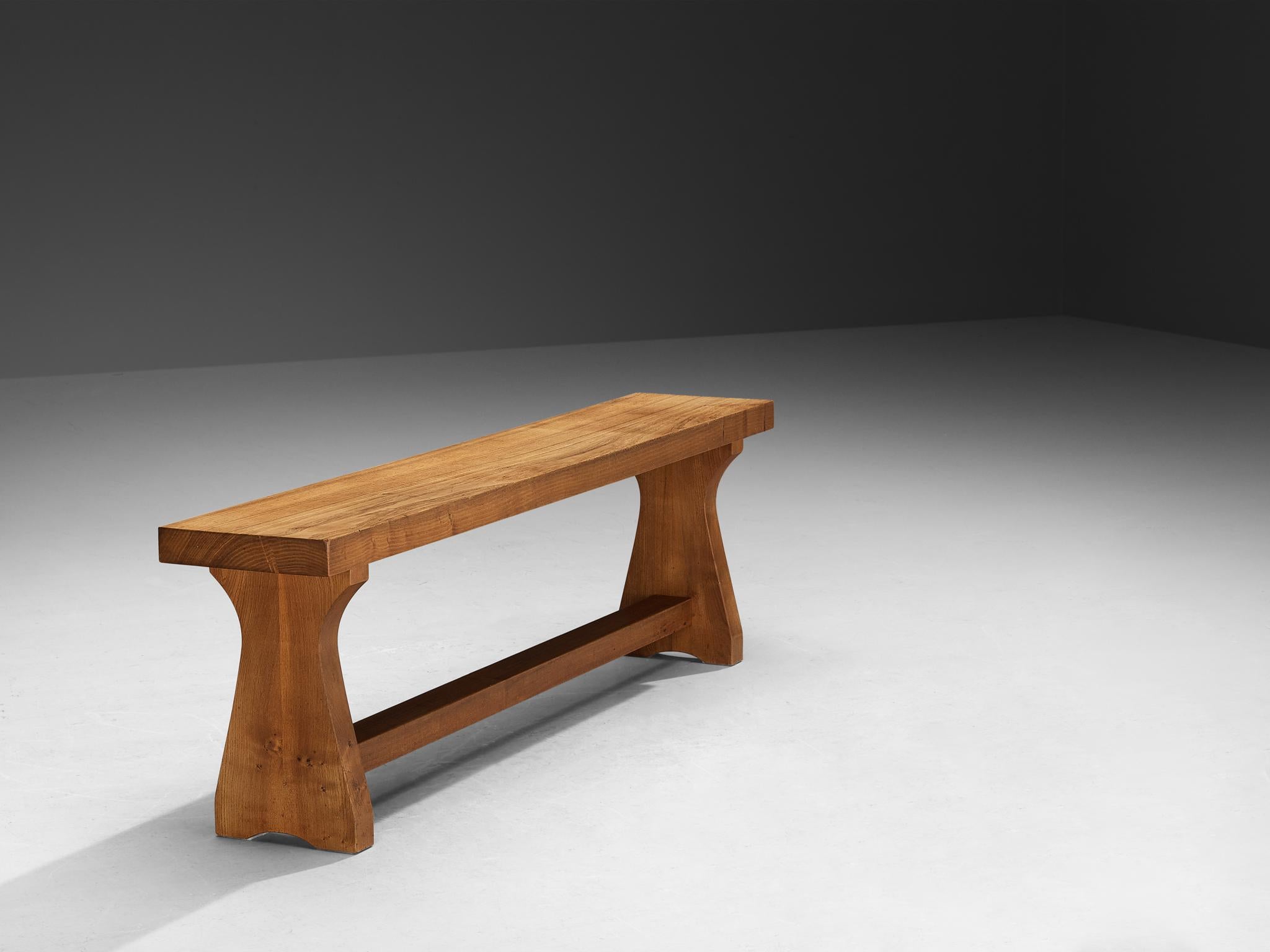 Atelier C. Demoyen, bench, solid elm, France, 1970s

Atelier C. Demoyen (Claude de Moyen) gained prominence as a workshop recognized for crafting, among others, Pierre Chapo's designs. Consequently, their own furniture creations bear the hallmark of