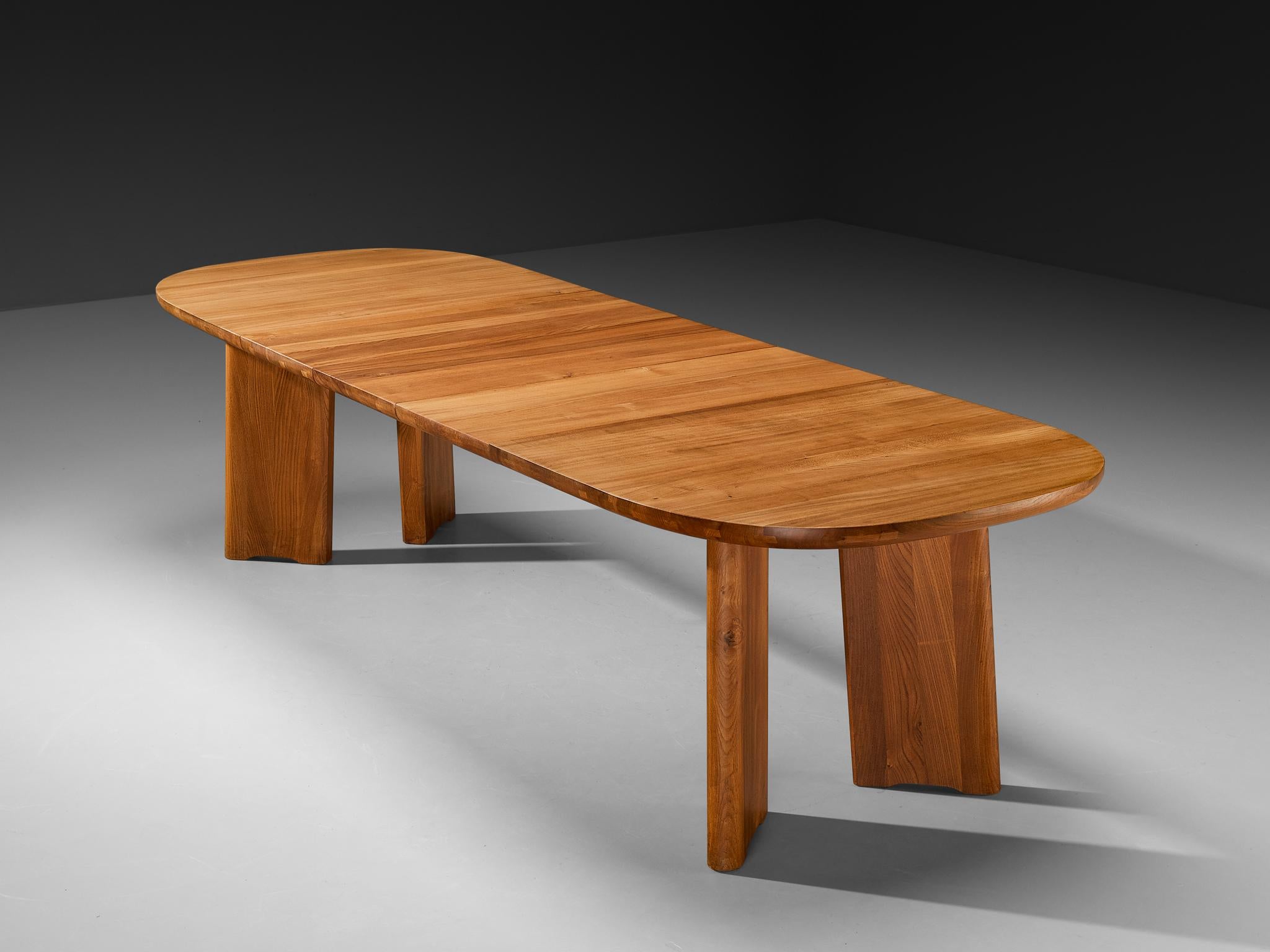 Atelier C. Demoyen, extendable dining table, solid elm, France, 1970s

Dining table by Atelier C. Demoyen in stunning solid elm wood. The table exhibits a refined design that is both sleek and contemporary in its appearance. The table features an