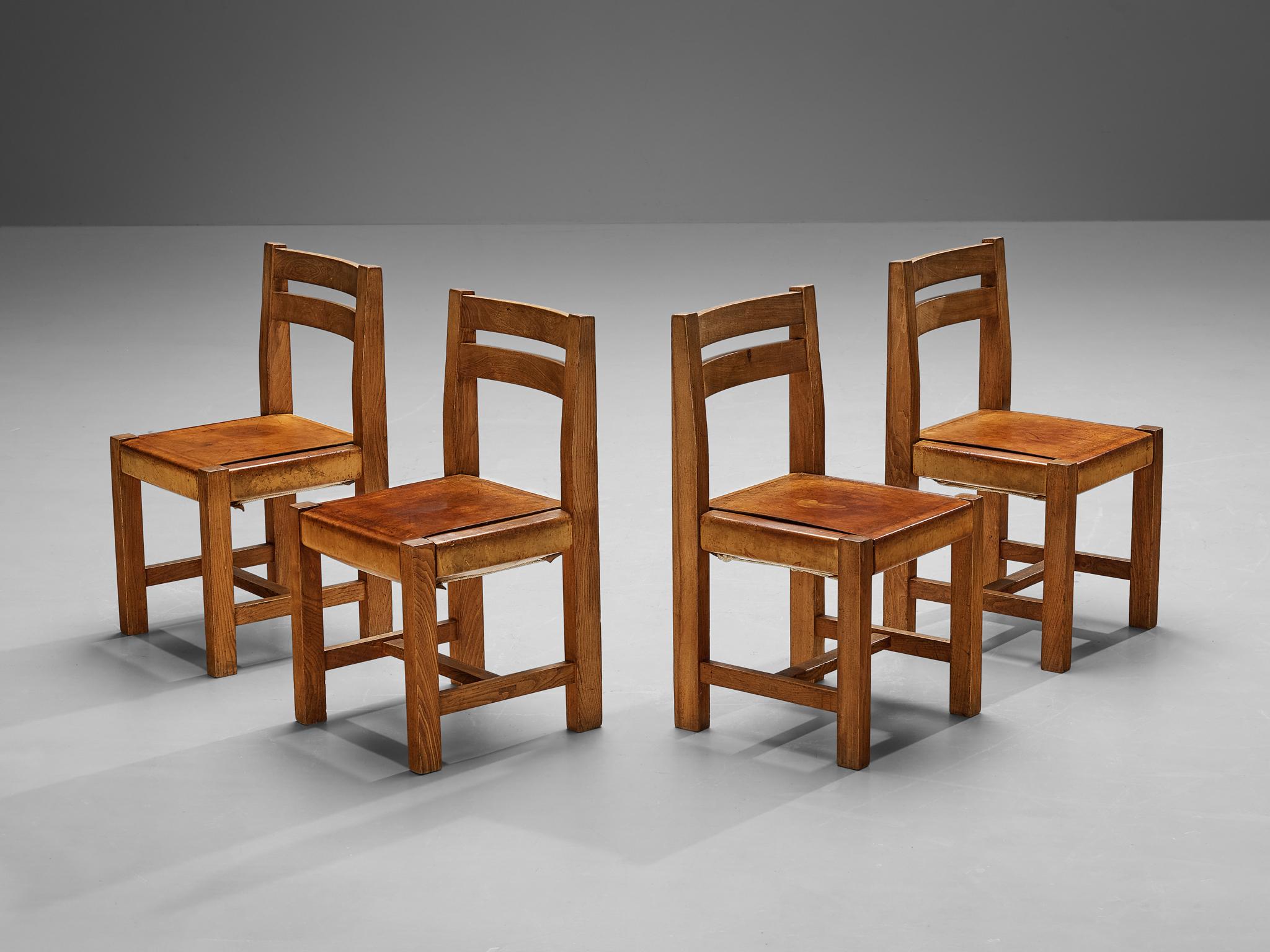 French Atelier C. Demoyen Set of Four Dining Chairs in Elm and Cognac Leather  For Sale