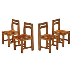 Ensemble de quatre chaises de salle à manger Atelier C. Demoyen en orme et cuir cognac 