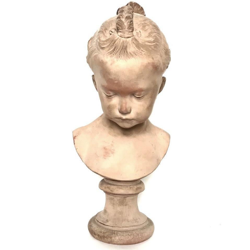 An 18th century terracotta bust of a young female child (Jeune Fille à la natte) by Atelier Jacques-Francois-Joseph Saly. Signed SALY. The marble bust is exhibited in the Victoria and Albert Museum, London.
Jacques François Joseph Saly, also known