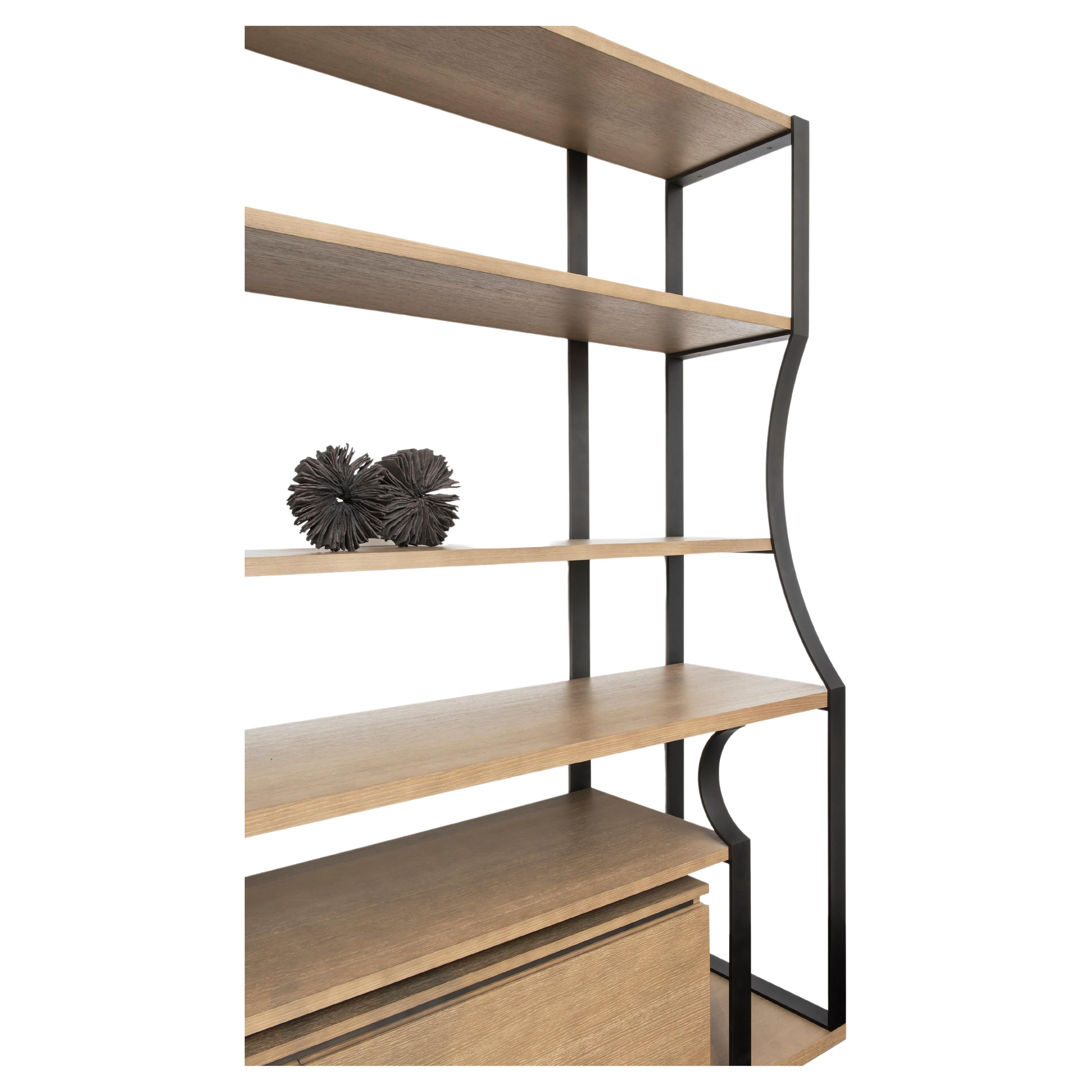 Bookcase designed by the Atelier Linné collective, with shelves made of oak and a structure made of steel. It is characterized by its sleek and flexible design and includes two cupboards in the lower part.

Atelier Linné is a collective of