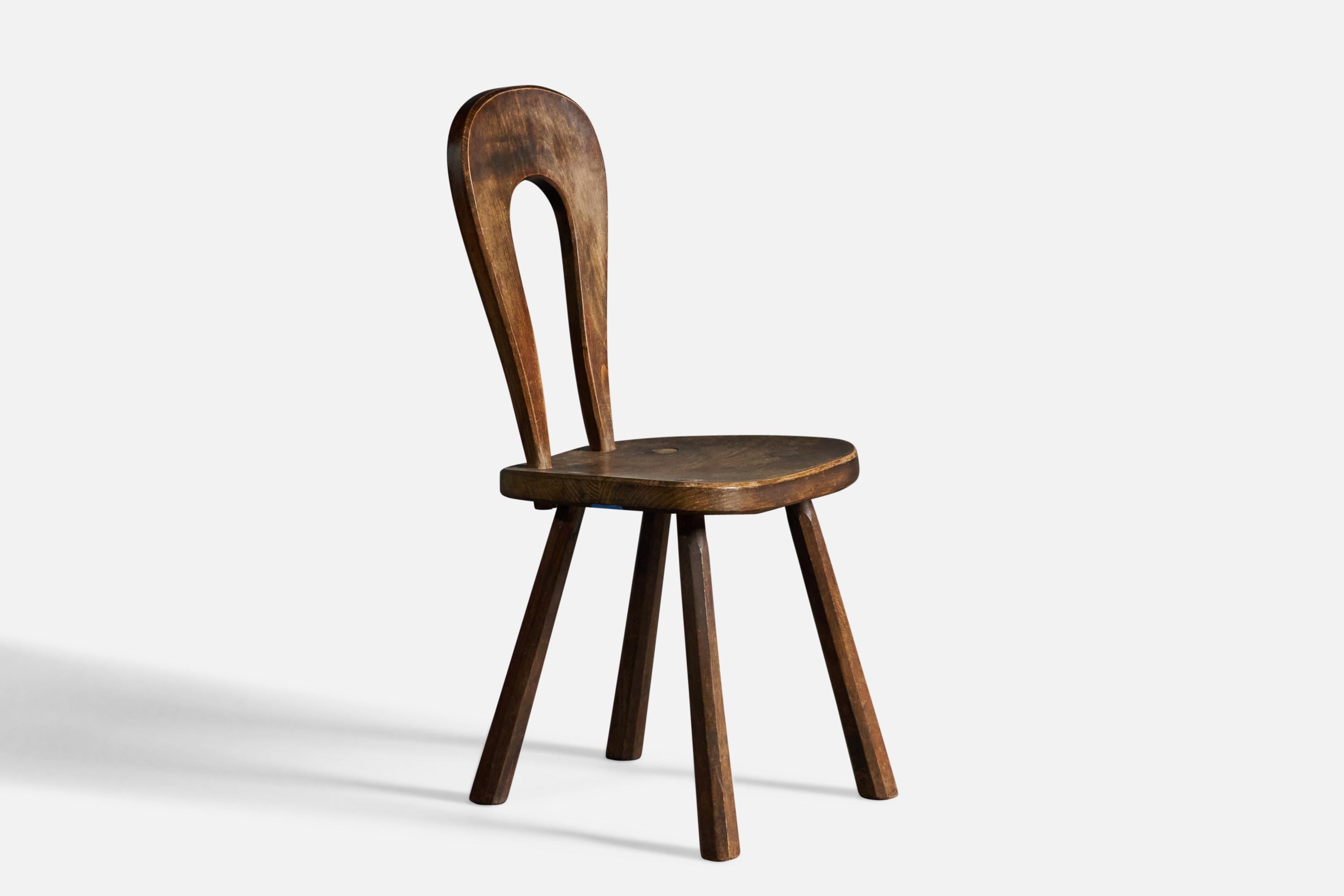 A stained oak side chair attributed to Atelier Marolles, France, 1960s.

18” seat height