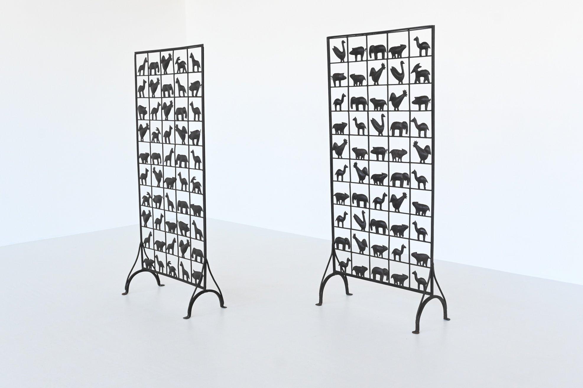 Beautiful and highly decorative screens designed and manufactured by Atelier Marolles, France, 1950. These screens are made of wrought iron and decorated with 50 animal figures. Very nice to divide spaces but not completely close them. The screens