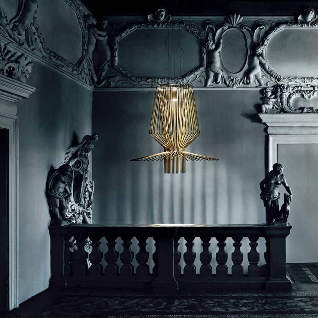 Atelier Oi ‘Allegro Assai’ LED chandelier lamp in gold for Foscarini.

Designed by Atelier Oi and produced by Foscarini, the Italian lighting firm founded in Venice on the legendary island of Murano, where generations of master craftsman have