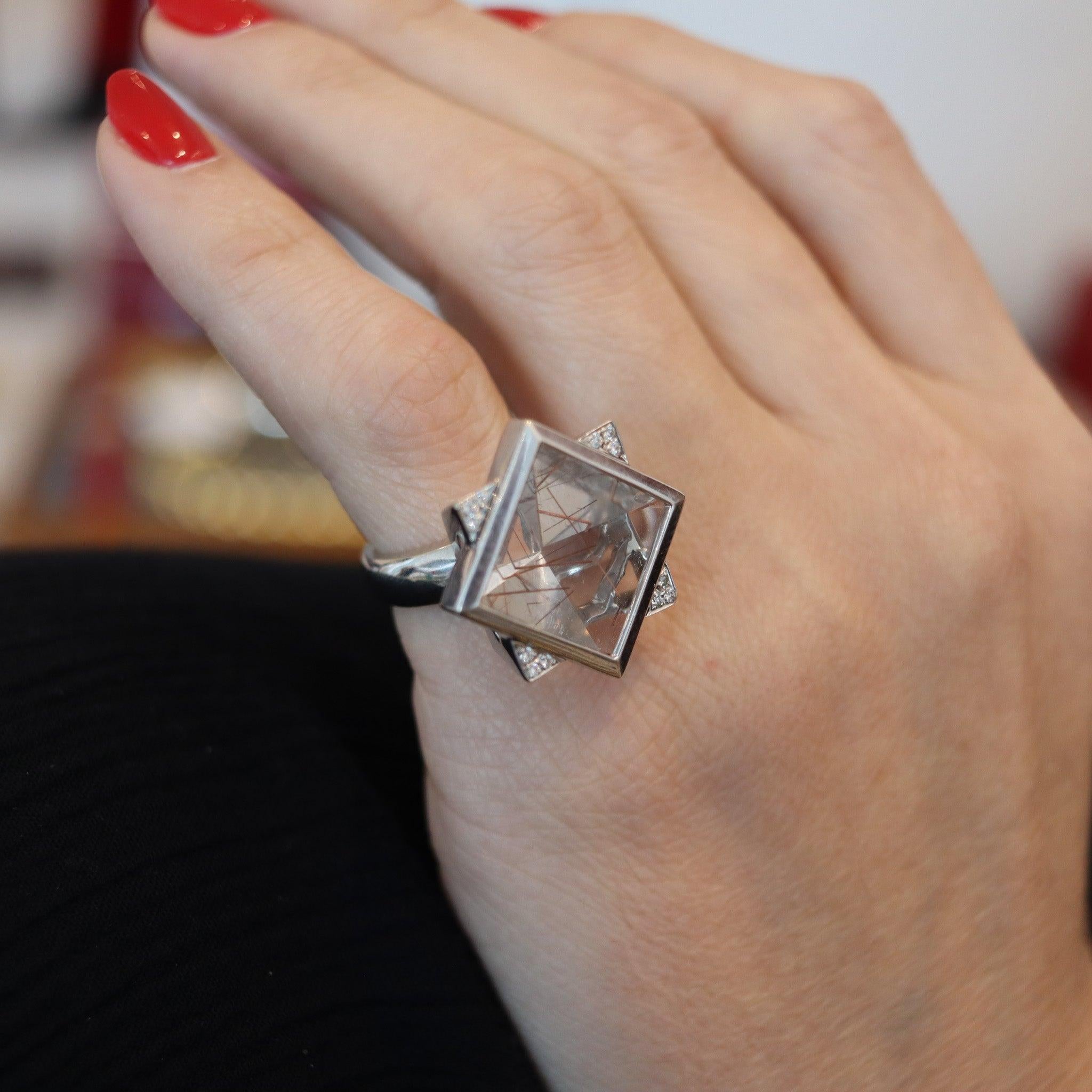 Geometric cocktail ring designed by Atelier Zobel.

This beautiful geometric cocktail ring, was created in Germany by Peter Schmid for the Atelier Zobel, back in the 1990. The ring has been crafted with cubism shapes in solid white gold of 18 karats