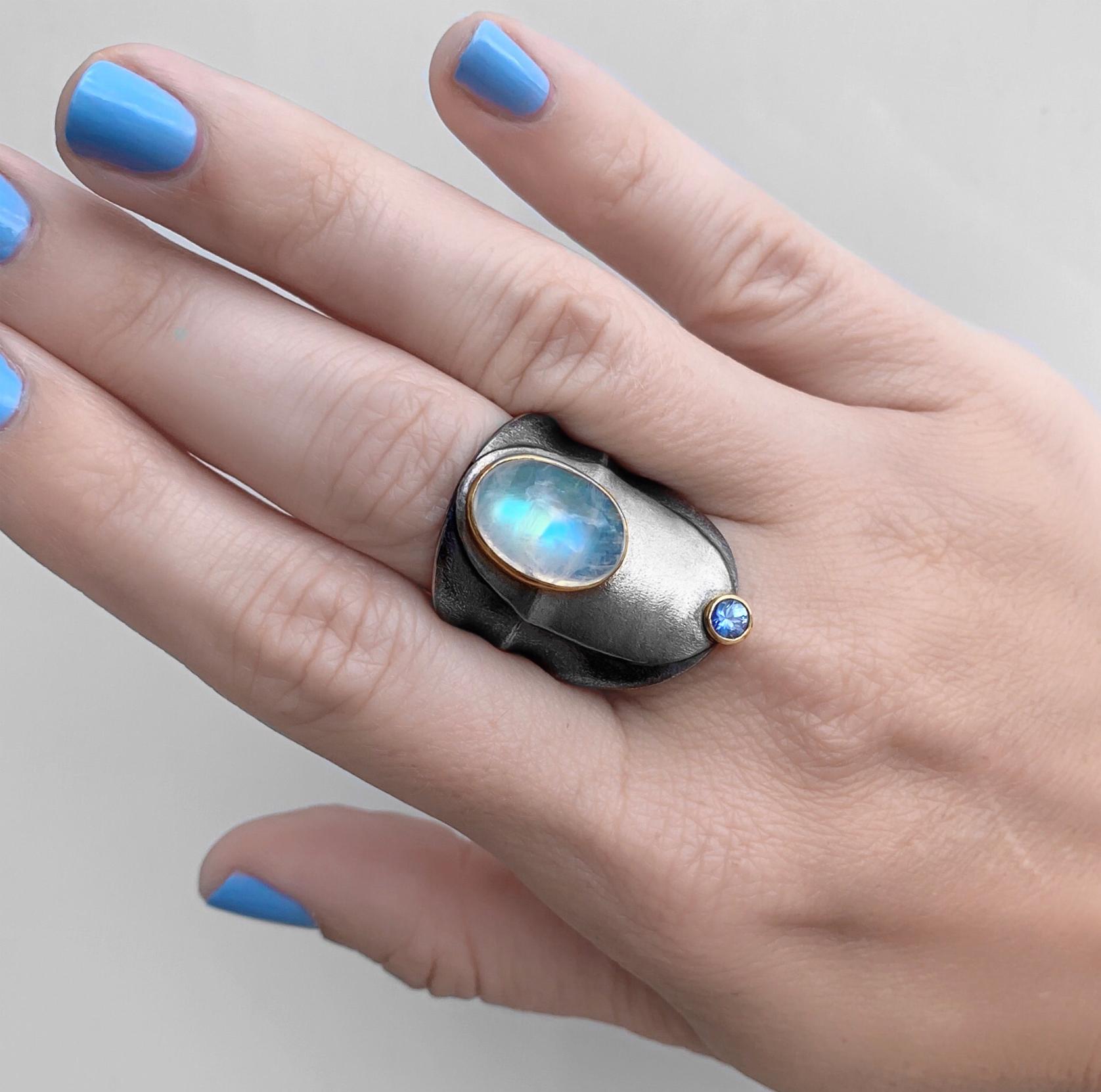 One of a Kind Double Stone Ring hand-fabricated in Germany by master jewellery maker Peter Schmid of Atelier Zobel, featuring a spectacular 6.12 carat cabochon-cut rainbow moonstone and a 0.24 carat natural lilac sapphire, each set in a 22k yellow