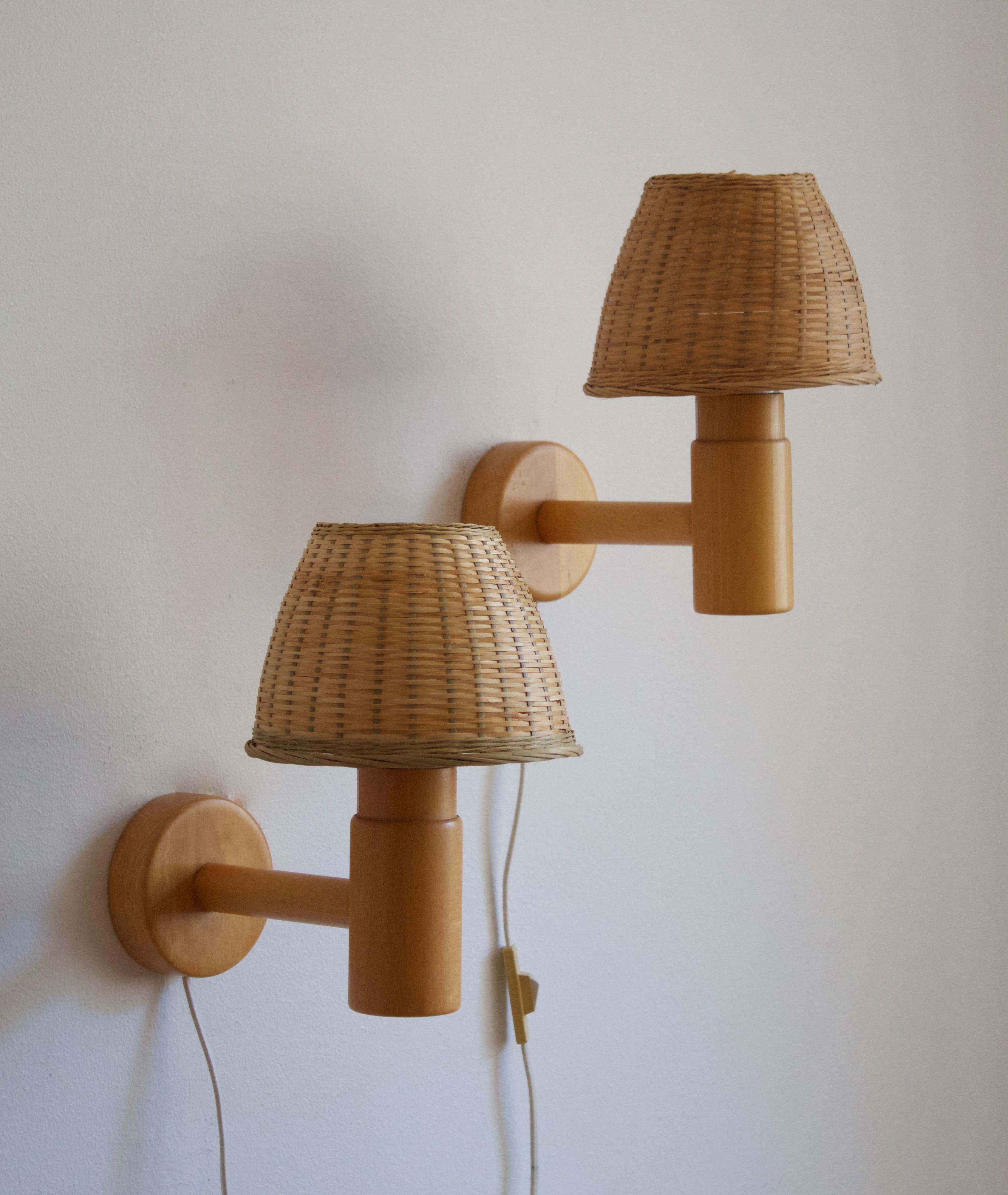 Pair of wall lights / sconces produced by Swedish Ateljé Lyktan. Assorted vintage rattan lampshades. Circa 1970s. Labeled.

Other Nordic lighting designers include Paavo Tynell, Hans-Agne Jacobson, Carl-Axel Acking, and Alvar Aalto.