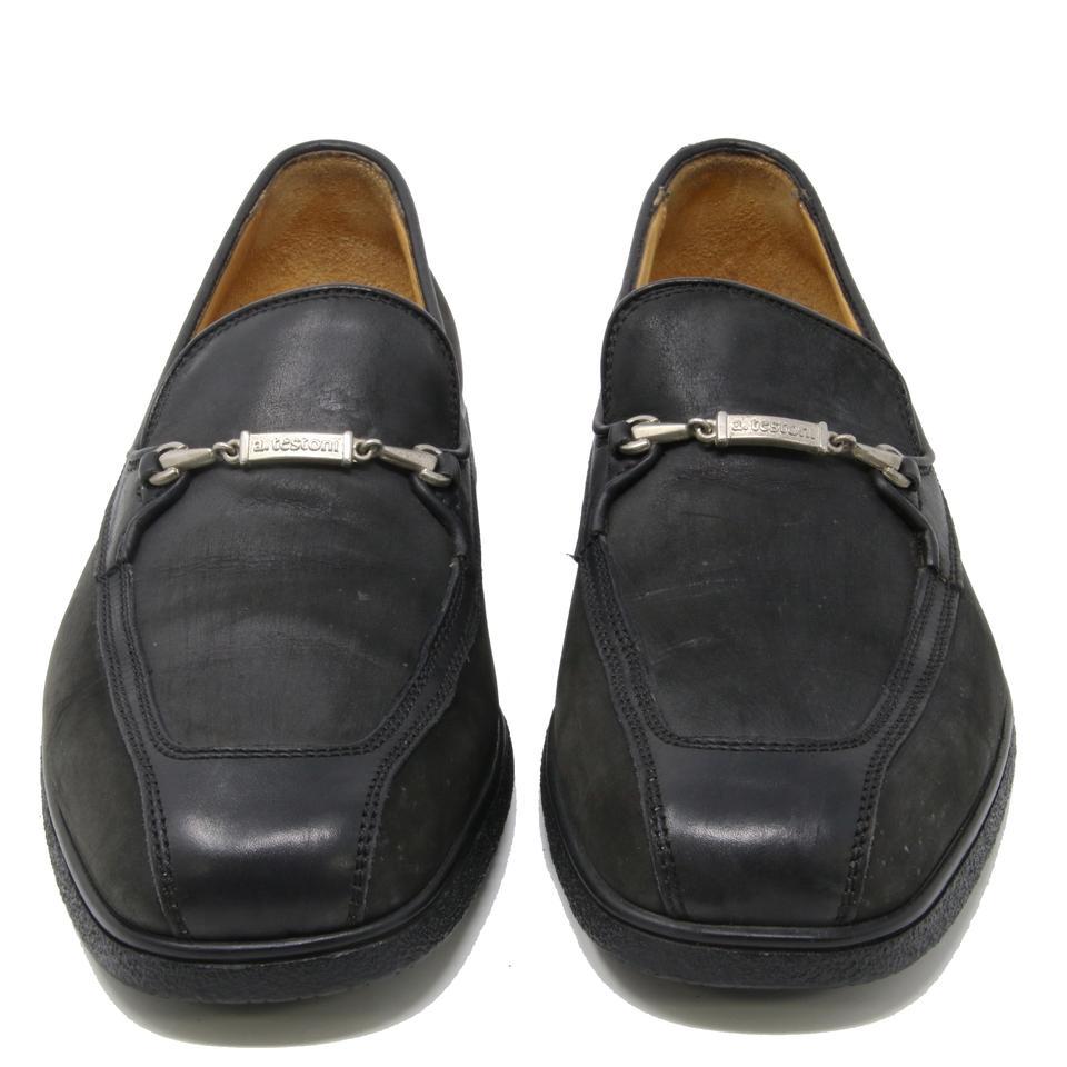 A.Testoni Black Leather Moc Toe Logo Stylized Horsebit Loafer Dress Shoes

A.testoni horsebit loafer features the smoothest black leather uppers and an exceptionally supple padded rubber sole. The insoles are leather and the soles are rubber. The