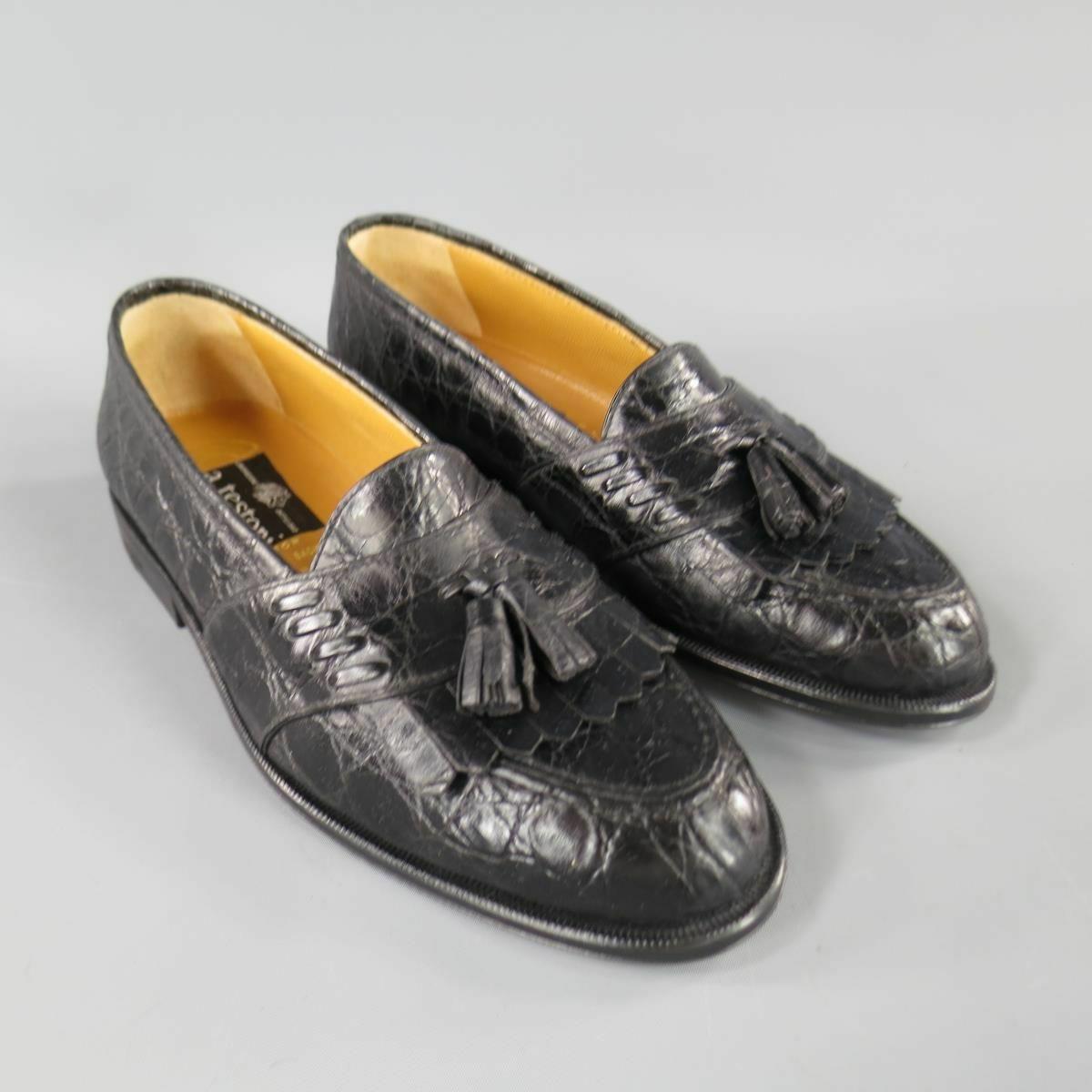 A. TESTONI for WILKES BASHFORD Loafers are alligator leather and feature tradition fringe and tassel detail along the toe in black, made in Italy.
 
Excellent Pre-Owned Condition    
Marked: 8.5
 
Measurements:
 
Insole: 10 in.
Width: 4 in.
Lift: 1