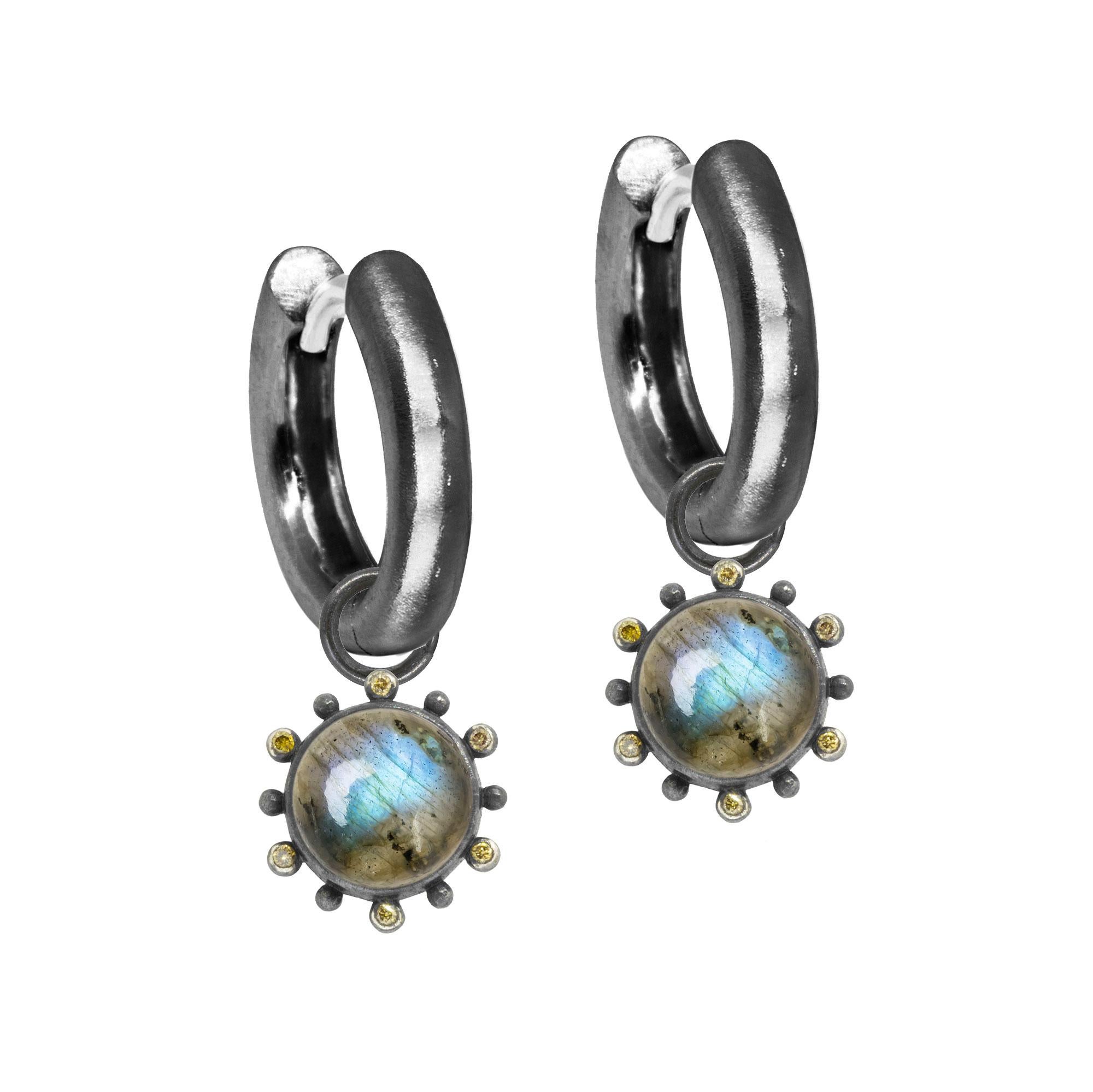 Nina Wynn Design's patent-pending earrings have an element on the back of the stud or charm to allow these pieces to transformed into multi-use, stackable and convertible styling. It can be turned into a pendant and worn on a necklace, or used as a