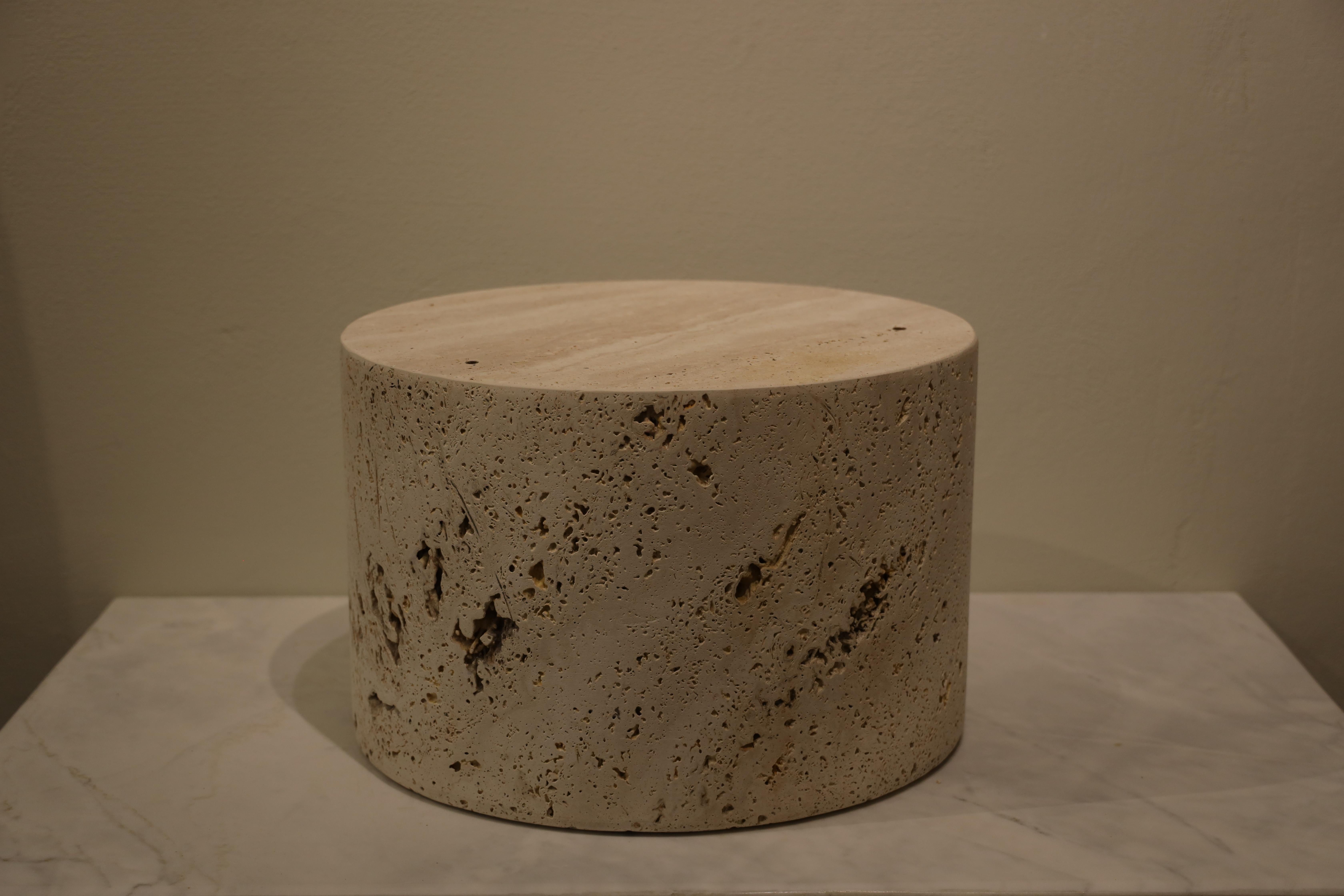 Introducing our exquisite Athena Travertine Side Table – the epitome of elegance and sophistication for your home decor. Crafted from genuine travertine stone, this unique piece is a testament to nature's artistry. Its surface showcases the stone's