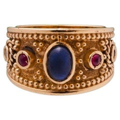 Antique Athenas Ring in 18k Gold with Centered Sapphire, Rubies & Diamonds