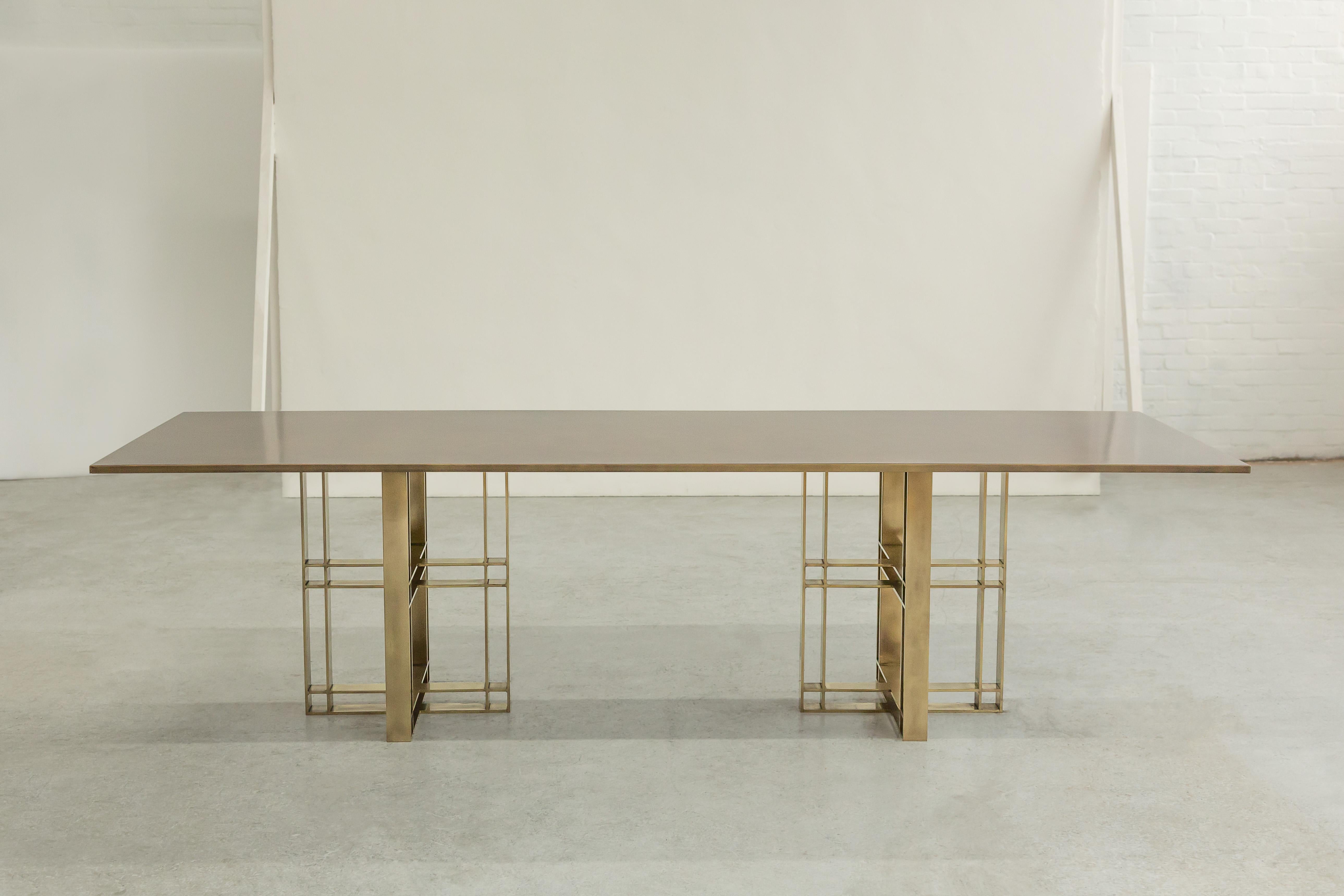 A dining table in patinated brass. Hand crafted in the North to order. Custom sizes and finishes are available.

Measures: 230cm (width) x 75cm (height) x 110cm (depth).
Custom sizes available. Available with marble or timber top.

Made to order in